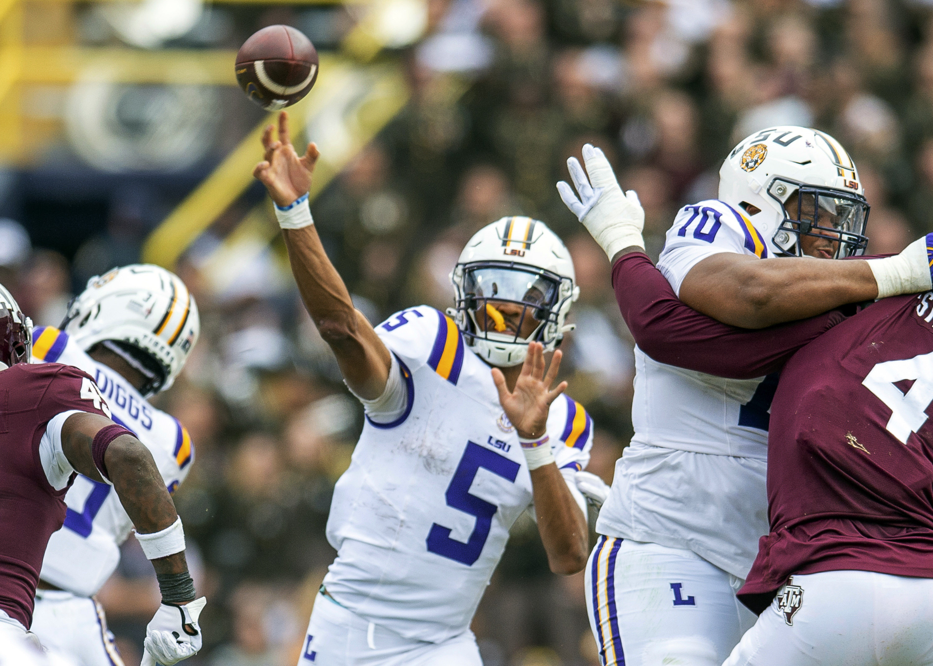LSU quarterback Jayden Daniels (5) throws during an NCAA college football game against Texas A&M in Baton Rouge, La., Saturday, Nov. 25, 2023.