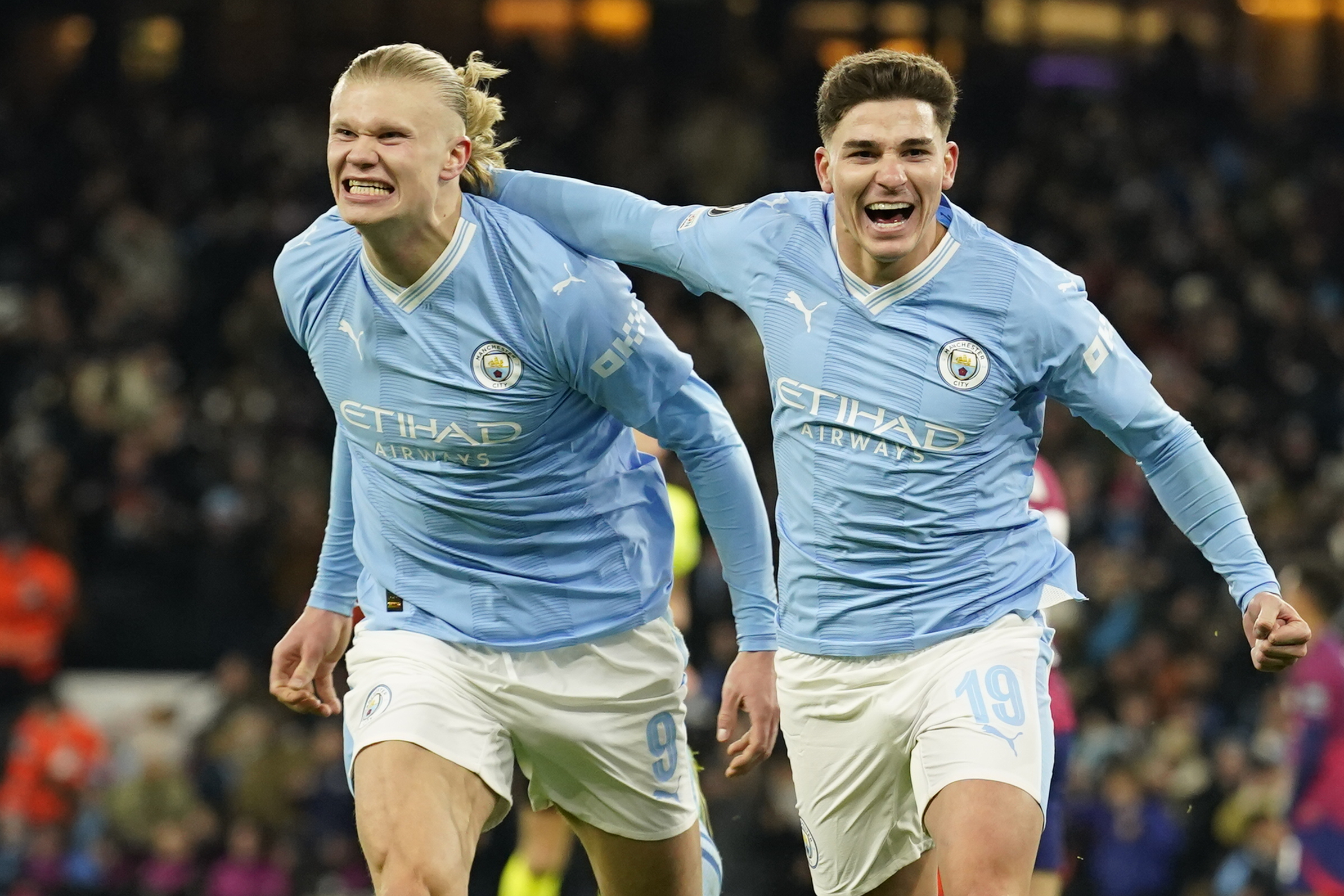 Manchester City's Julian Alvarez, right, celebrates with Manchester City's Erling Haaland after scoring his side's third goal during the group G Champions League soccer match between Manchester City and RB Leipzig at the Etihad stadium in Manchester, England, Tuesday, Nov. 28, 2023. 