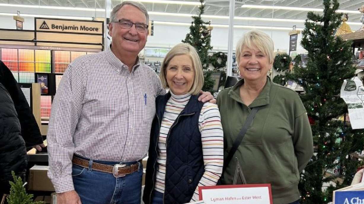 “A Christmas Journey" book signing at Buck’s Ace Hardware in Santa Clara with, left to right, Lyman Hafen, his wife Debbie and illustrator Ester West, Santa Clara, in this undated photo.