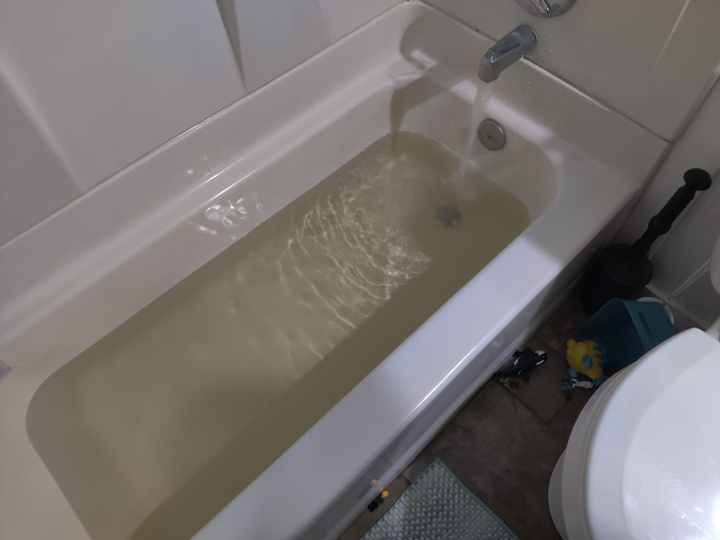 Yellow water fills in a tub in northern Utah on Dec. 7. Water managers said Friday they believe they now know why water turned yellow at several homes across northern Utah last week.