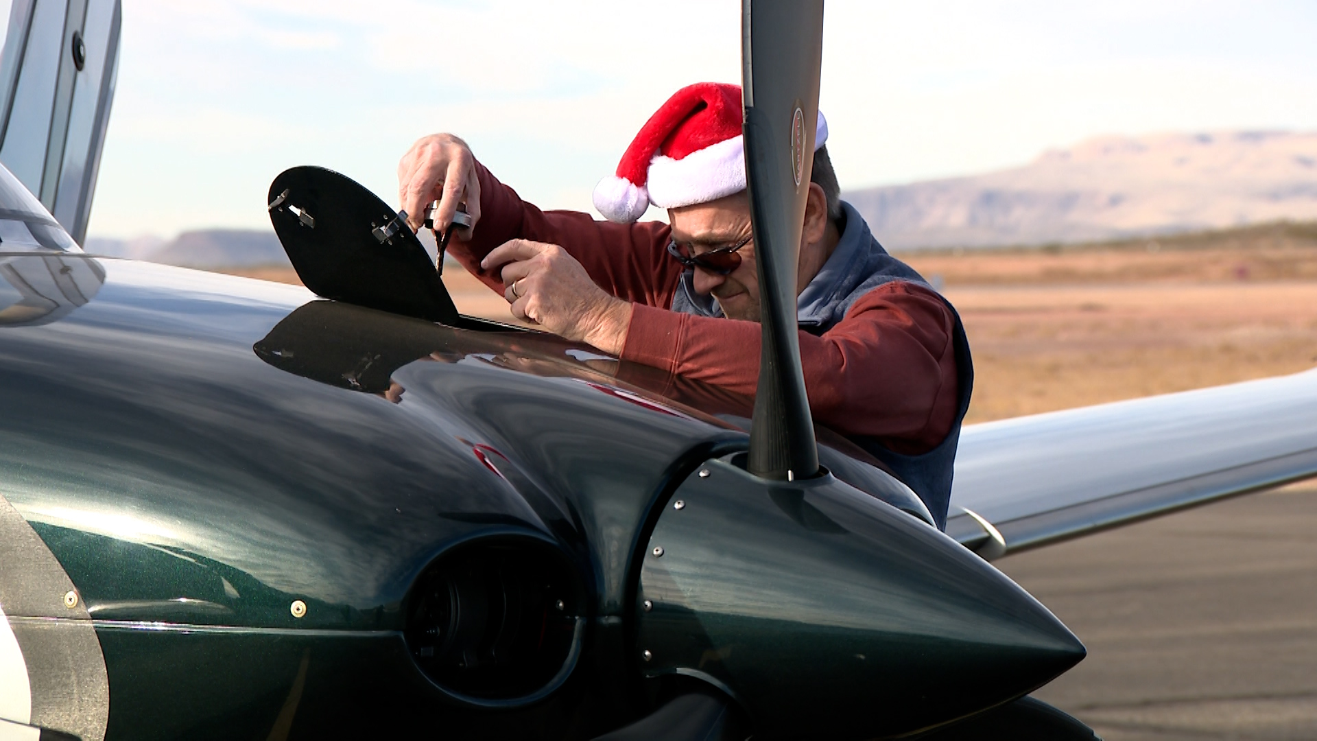 Pilot David Hellberg works on Santa’s airplane on Thursday in St. George. Pilots gather cash donations, school supplies and toys for schools as part of the Angel Flight program.