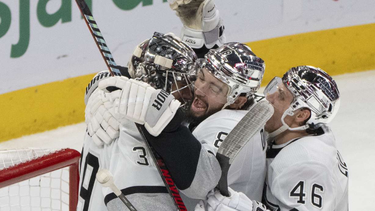 Los Angeles Kings goaltender Cam Talbot (39) is congratulated for the team's shutout win over the Montreal Canadiens by Drew Doughty (8) and Blake Lizotte (46), after an NHL hockey game Thursday, Dec. 7, 2023, in Montreal.