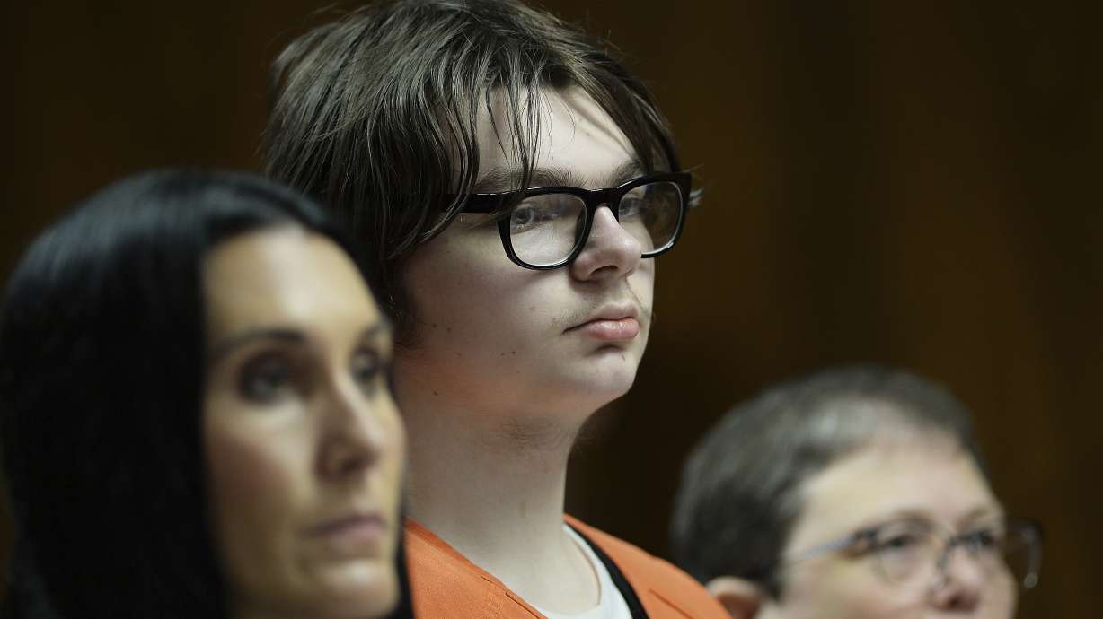Ethan Crumbley stands with his attorneys, Paulette Loftin and Amy Hopp, during his hearing at Oakland County Circuit Court, Aug. 1, in Pontiac, Mich. Crumbley, who killed four other students at a Michigan school, was sentenced to life in prison Friday.