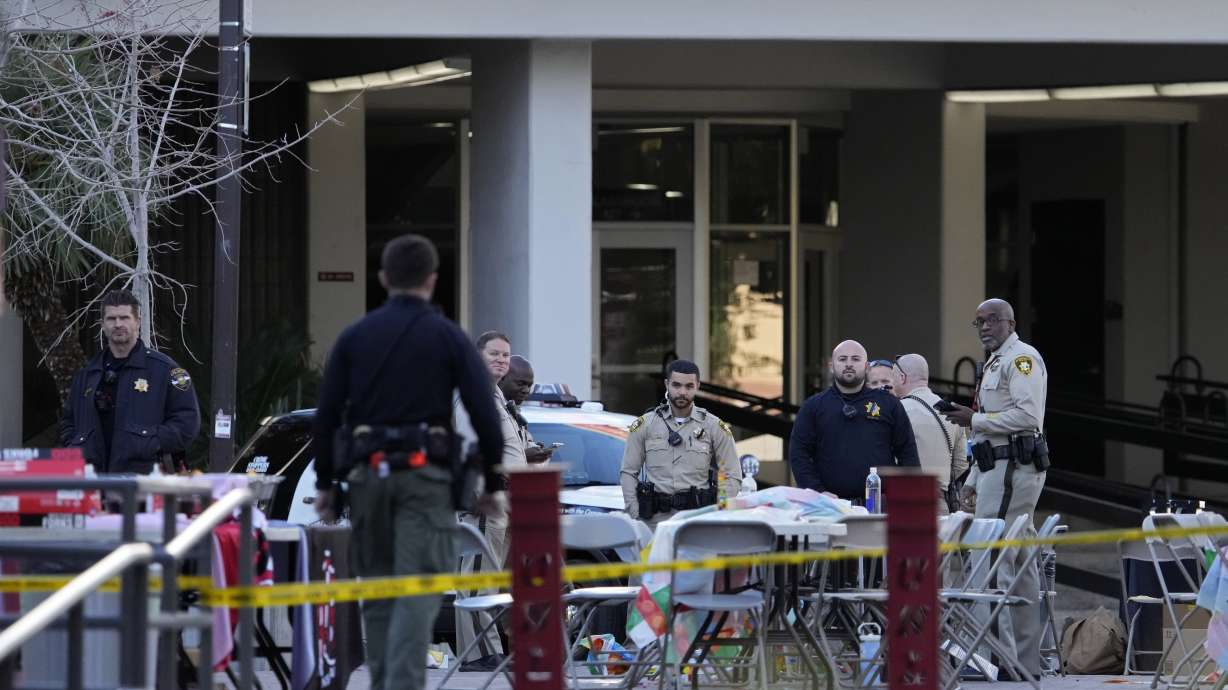 Las Vegas police stand near the scene of a shooting at the University of Nevada, Las Vegas in Las Vegas Thursday.