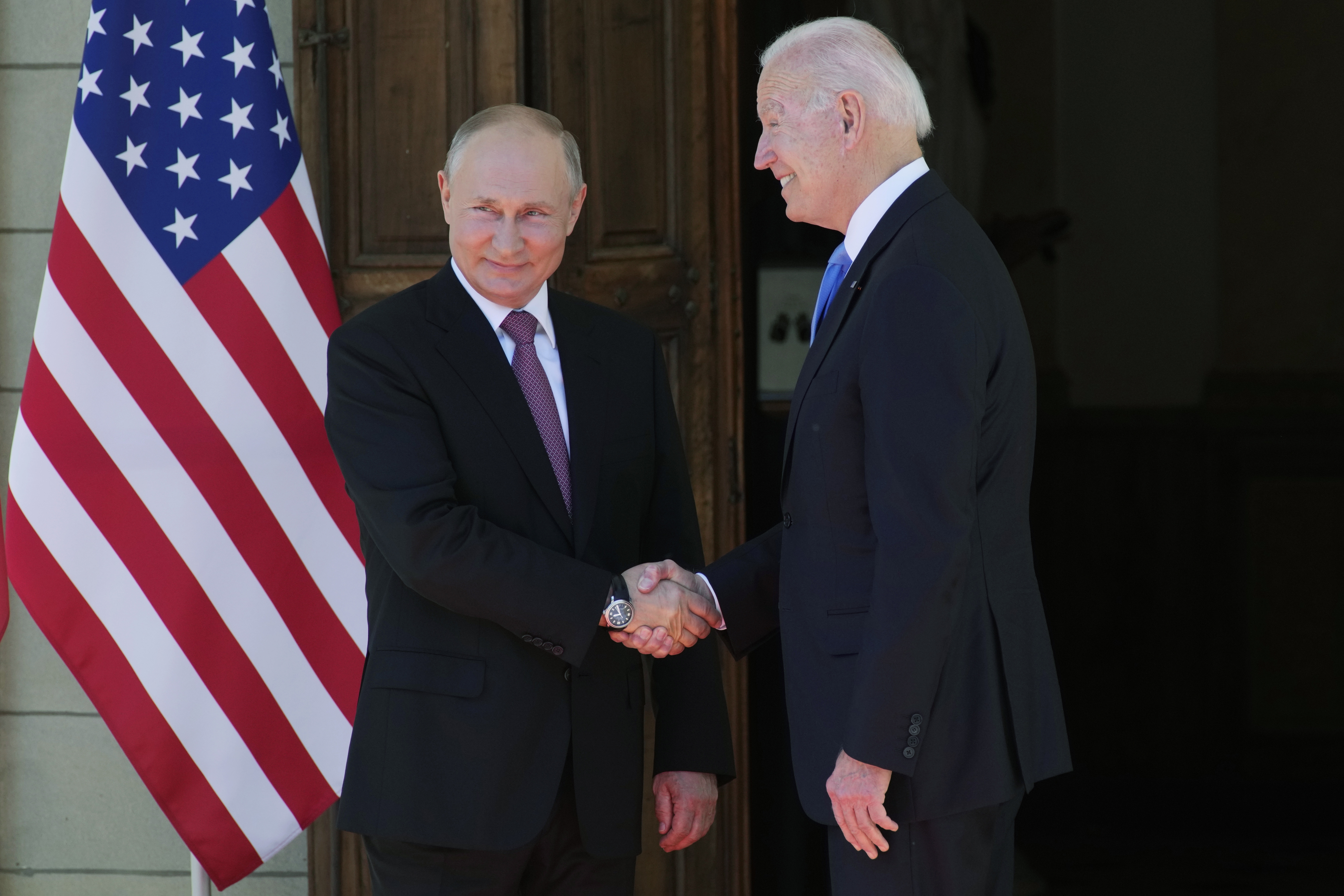 Russian President Vladimir Putin, left, and U.S President Joe Biden shake hands during their meeting at the 'Villa la Grange' in Geneva, Switzerland in Geneva, Switzerland, on June 16, 2021.