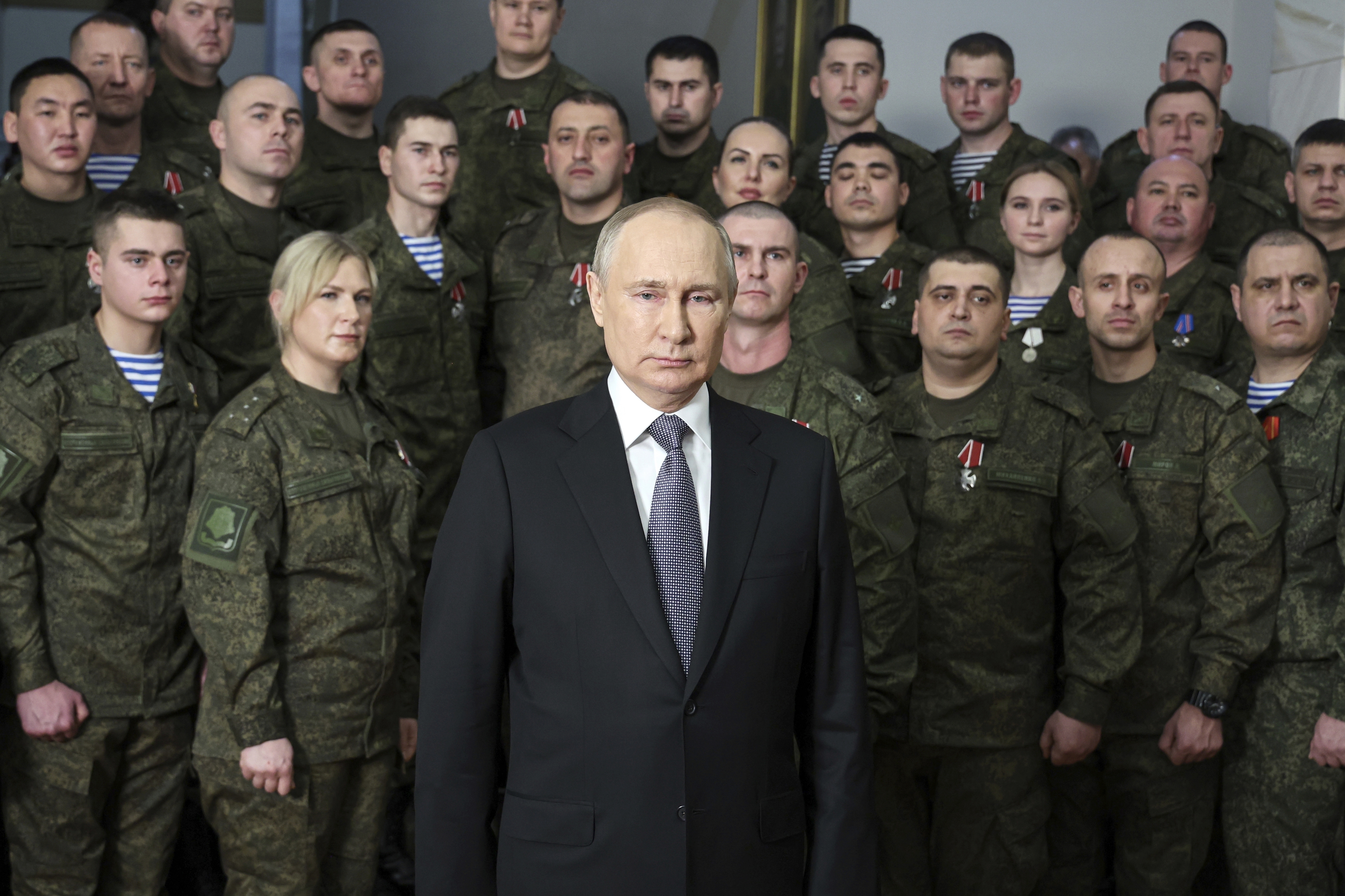 President Vladimir Putin speaks in his annual televised New Year's message after a ceremony during a visit to the headquarters of the Southern Military District, at an unknown location in Russia, on Dec. 31, 2022.