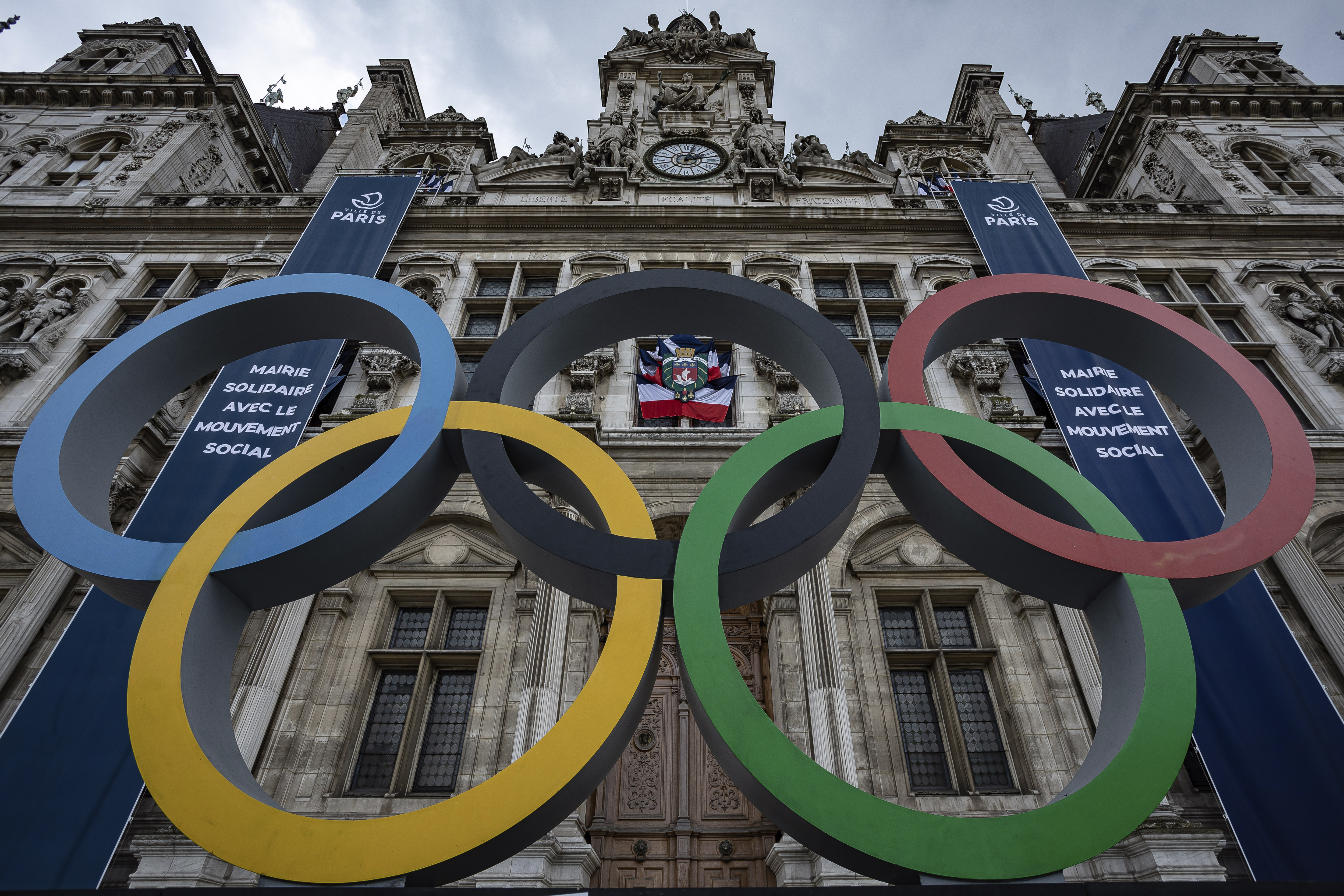 FILE - The Olympic rings in front of the Paris City Hall, in Paris, Sunday, April 30, 2023. Some Russian athletes will be allowed to compete at the 2024 Paris Olympics, the IOC said Friday, Dec. 8, 2023 in a decision that removed the option of a blanket ban over the invasion of Ukraine.