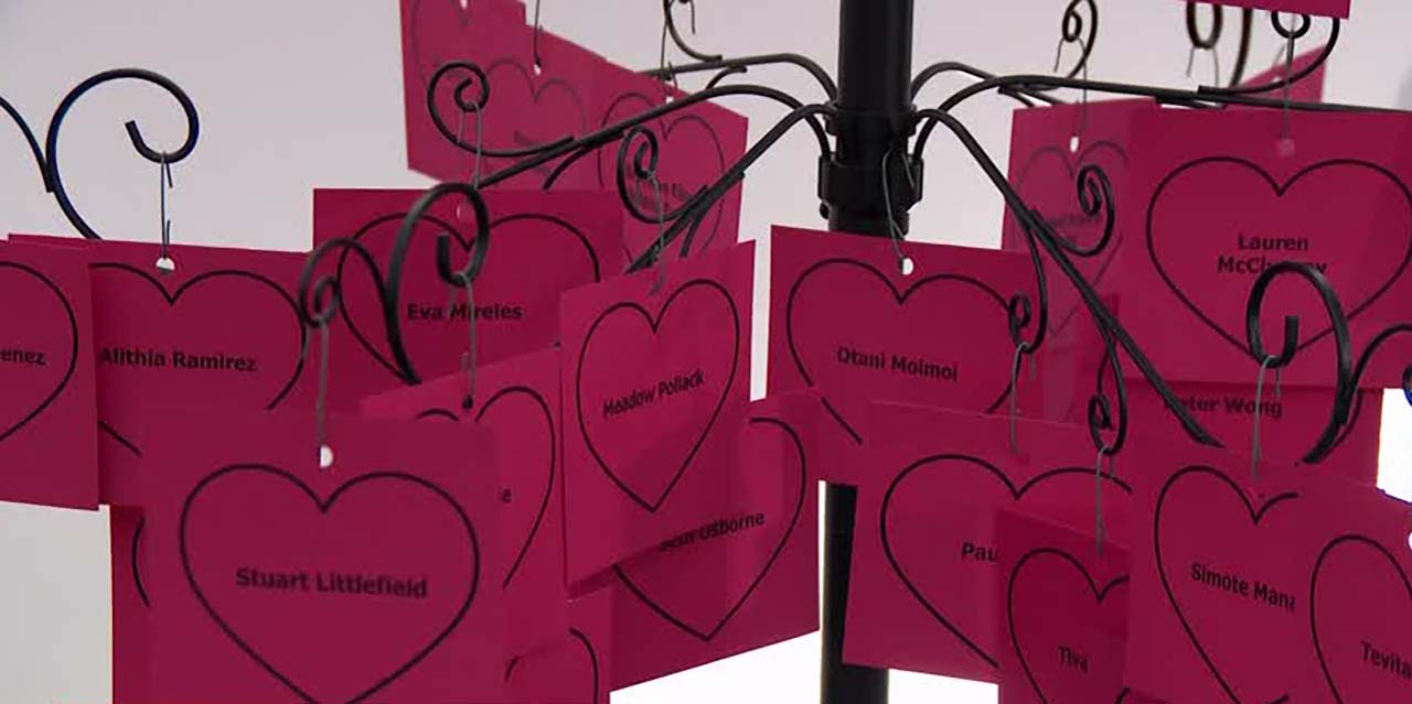 A vigil was held Thursday evening at Community of Grace Presbyterian Church in Sandy to remember those who died from being shot in the past year. Their names appear on a tree.