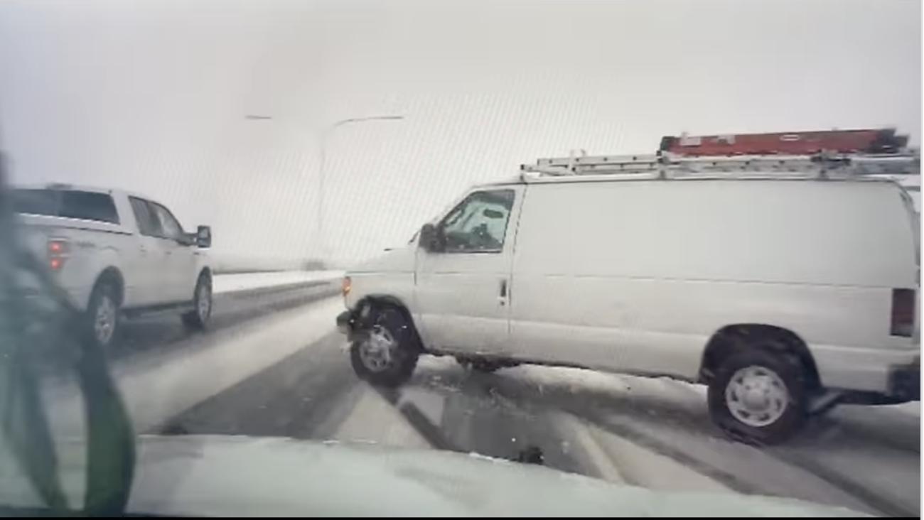 Utah Highway Patrol trooper Juan Branchini experienced a close call on the roads in Davis County when a white van slid across the lane in front of him.