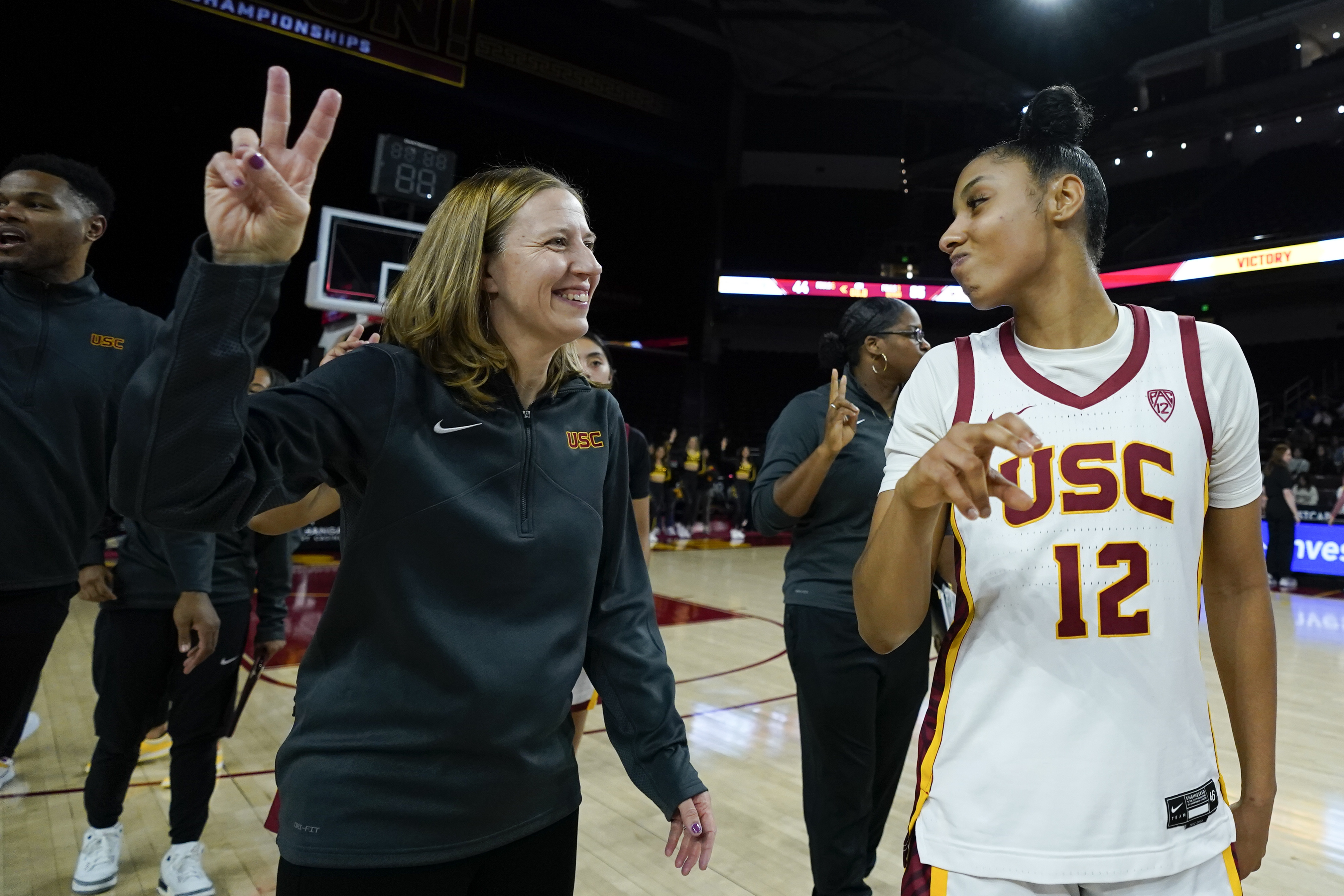 Southern California head coach Lindsay Gottlieb, left, and guard JuJu Watkins (12) react after the team's victory over Cal Poly, Tuesday, Nov. 28, 2023, in Los Angeles.