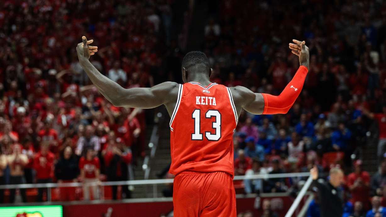 Utah Utes center Keba Keita (13) hypes the crowd after his second dunk during a mens basketball game against the Brigham Young Cougars at the Jon M. Huntsman Center in Salt Lake City on Saturday, Dec. 9, 2023.
