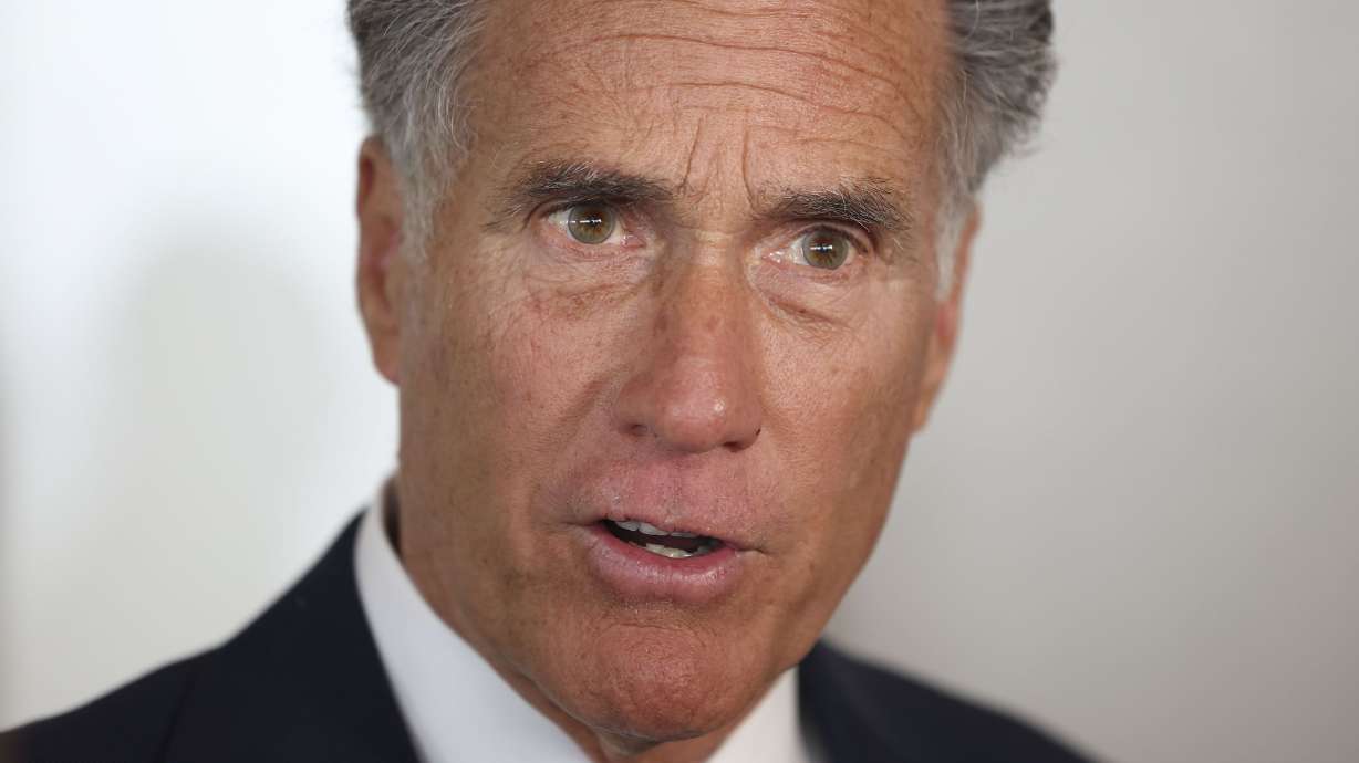 Sen. Mitt Romney speaks to reporters in Utah on Feb. 23. Romney went on Meet the Press Sunday to explain why he thinks border security measures should be included in a final agreement on aid for Ukraine and Israel, and he responded to Donald Trump's recent comments on being a "dictator."