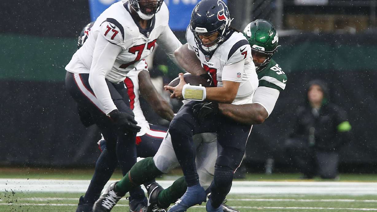 New York Jets defensive tackle Quinnen Williams (95) sacks Houston Texans quarterback C.J. Stroud (7) during the fourth quarter of an NFL football game, Sunday, Dec. 10, 2023, in East Rutherford, N.J.