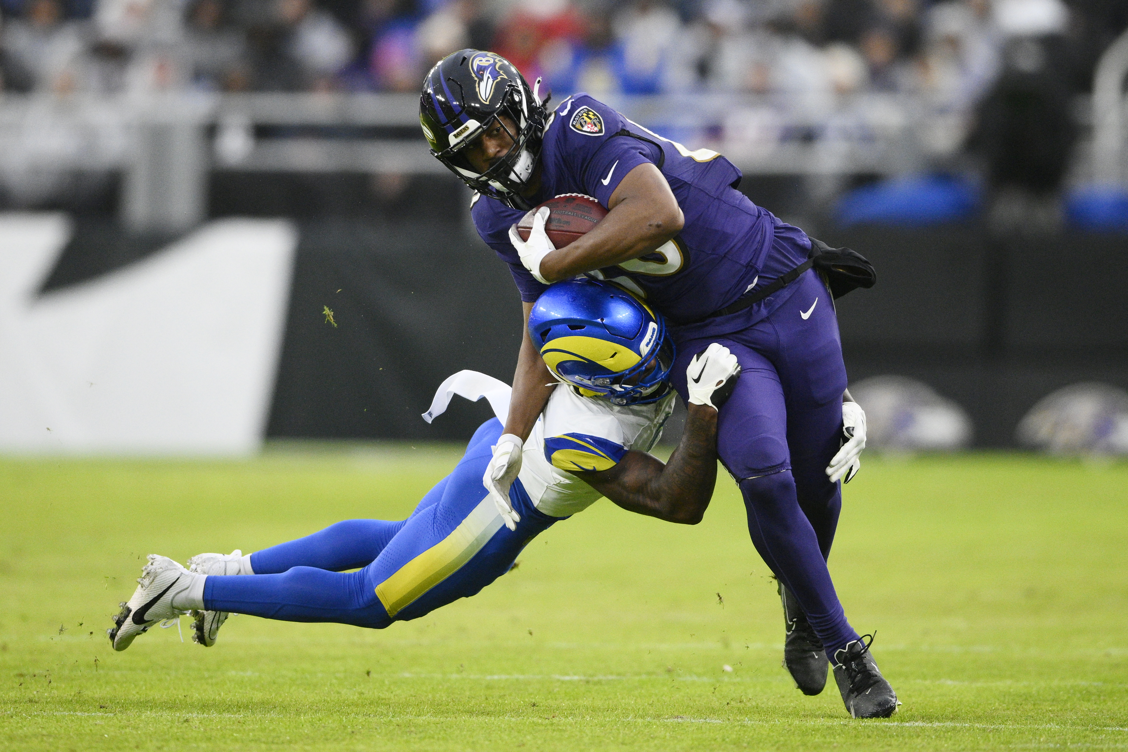 Baltimore Ravens tight end Isaiah Likely, right, gets tackled by Los Angeles Rams safety Russ Yeast during the second half of an NFL football game Sunday, Dec. 10, 2023, in Baltimore.