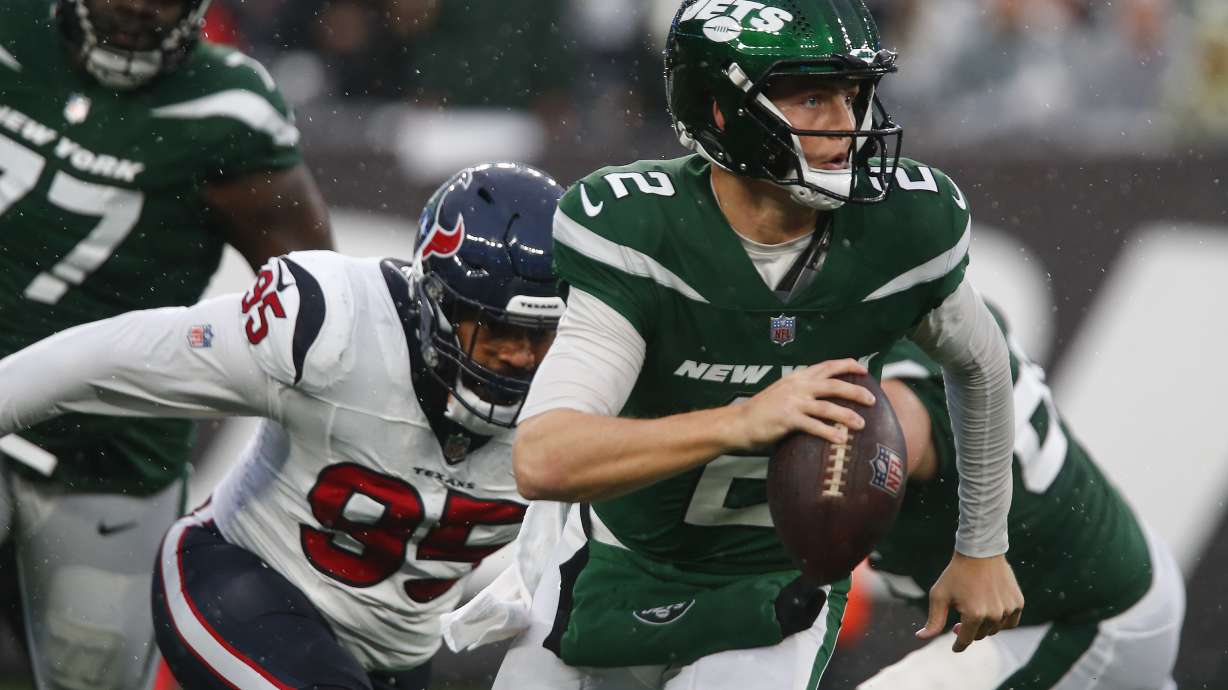 New York Jets quarterback Zach Wilson (2) looks to pass against the Houston Texans during the third quarter of an NFL football game, Sunday, Dec. 10, 2023, in East Rutherford, N.J.