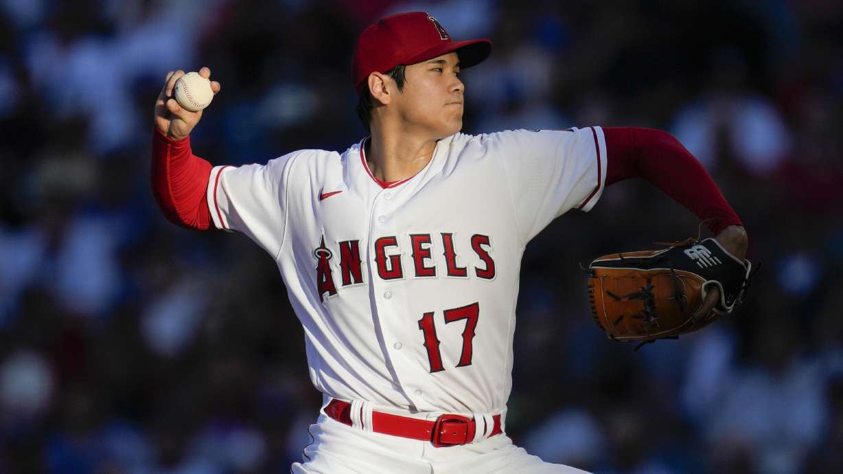 FILE - Los Angeles Angels starting pitcher Shohei Ohtani throws during a baseball game against the Los Angeles Dodgers in Anaheim, Calif., June 21, 2023. Ohtani agreed Saturday, Dec. 9, to a record $700 million, 10-year contract with the Dodgers.
