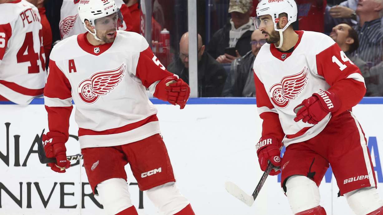 Detroit Red Wings center Robby Fabbri (14) celebrates his goal with left wing David Perron (57) during the first period of an NHL hockey game Tuesday, Dec. 5, 2023, in Buffalo, N.Y.
