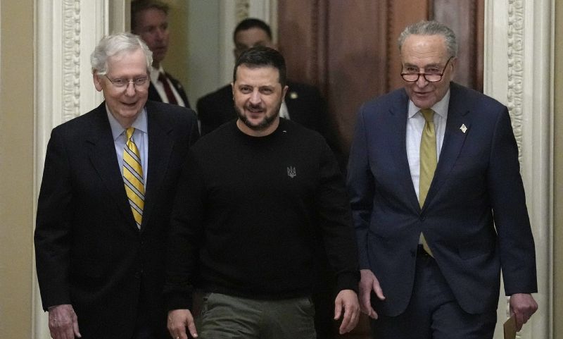 Ukrainian President Volodymyr Zelenskyy, center, walks with Senate Minority Leader Mitch McConnell, left, and Senate Majority Leader Chuck Schumer, right, during a visit to Capitol Hill in Washington, Tuesday.