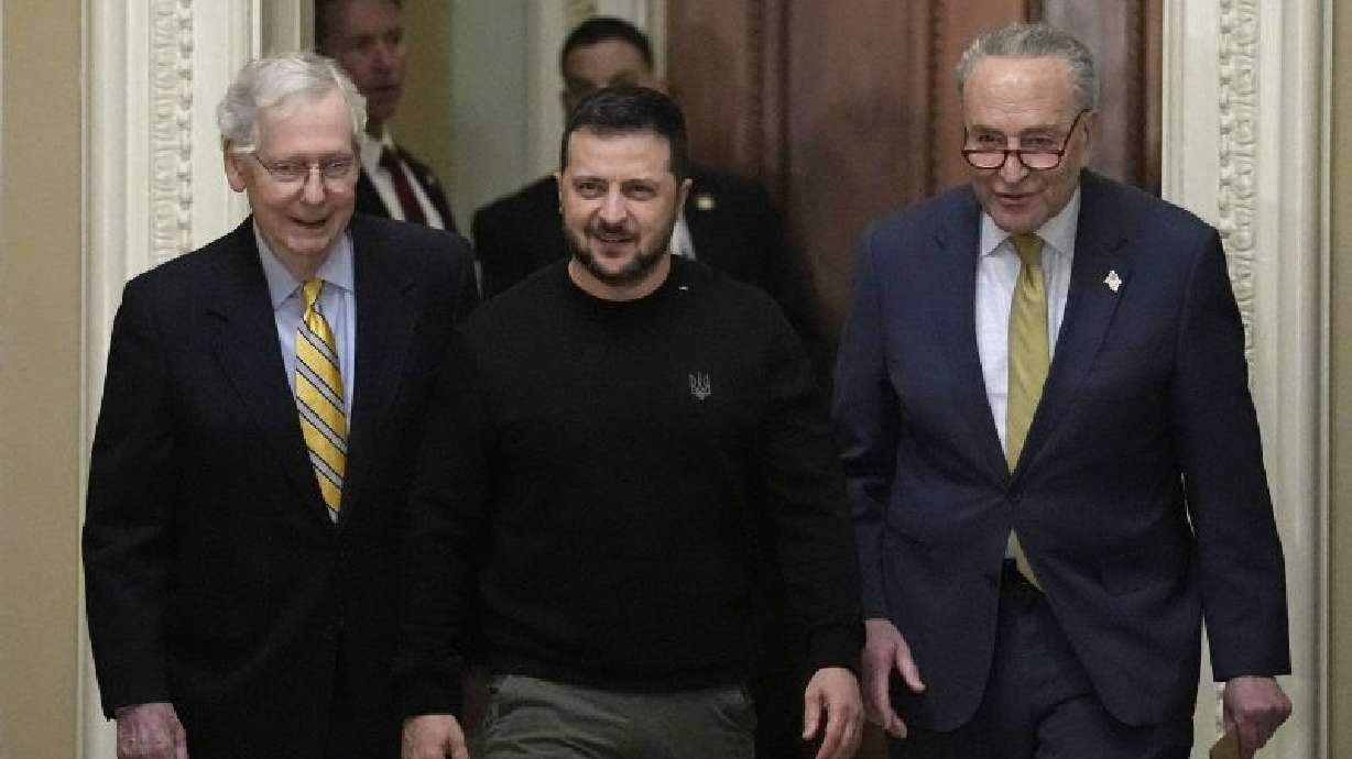 Ukrainian President Volodymyr Zelenskyy, center, walks with Senate Minority Leader Mitch McConnell, left, and Senate Majority Leader Chuck Schumer, right, during a visit to Capitol Hill in Washington, Tuesday.