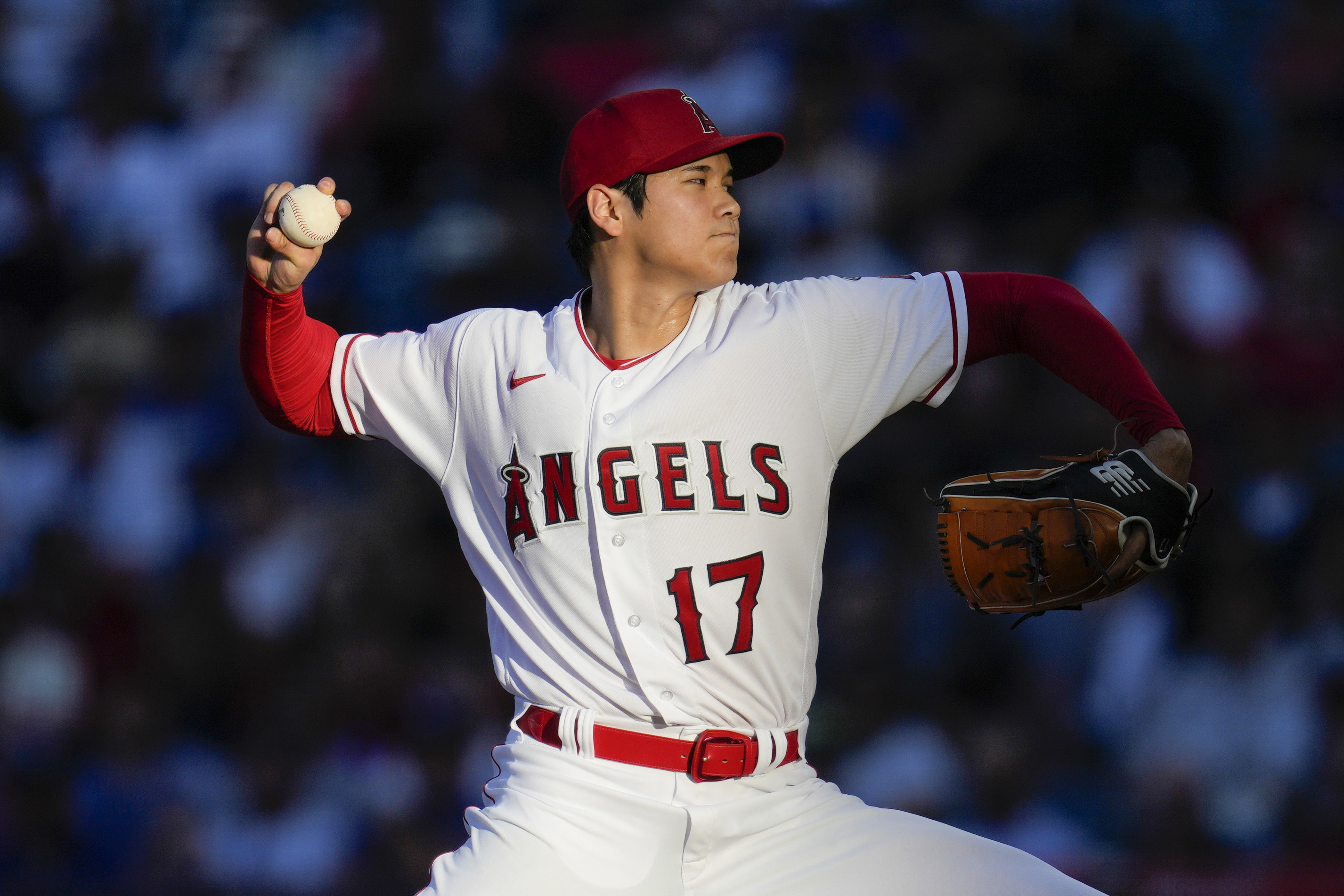FILE - Los Angeles Angels starting pitcher Shohei Ohtani throws during a baseball game against the Los Angeles Dodgers in Anaheim, Calif., June 21, 2023. Ohtani agreed Saturday, Dec. 9, to a record $700 million, 10-year contract with the Dodgers. 