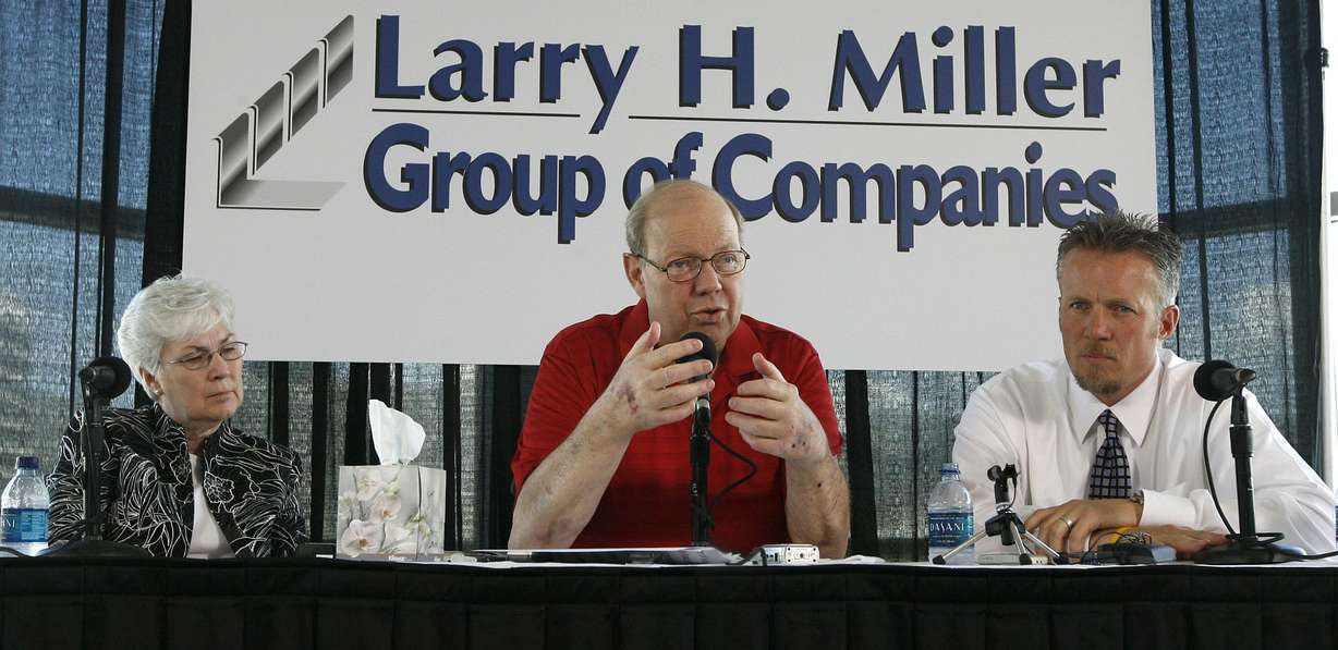 Larry H. Miller talks at a press conference after being released from a long stay in the hospital fighting numerous health problems in Salt Lake City on Aug. 8, 2008. His wife, Gail Miller, and son, Greg Miller, are seated next to him.