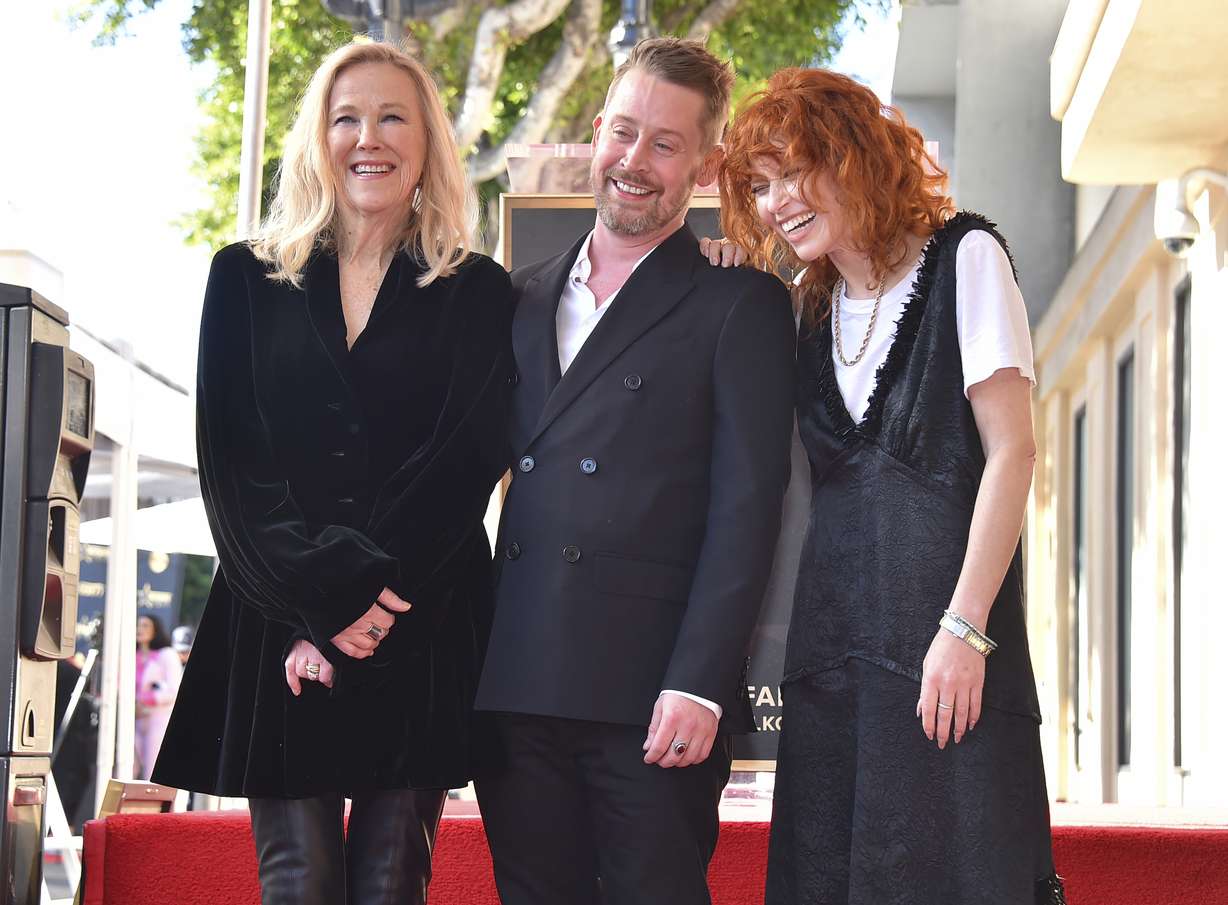 Catherine O'Hara, Macaulay Culkin and Natasha Lyonne attend a ceremony honoring Culkin with a star on the Hollywood Walk of Fame on Dec. 1, 2023, in Los Angeles. Culkin paid tribute to his "Home Alone" costar, O'Hara, who died on Friday.