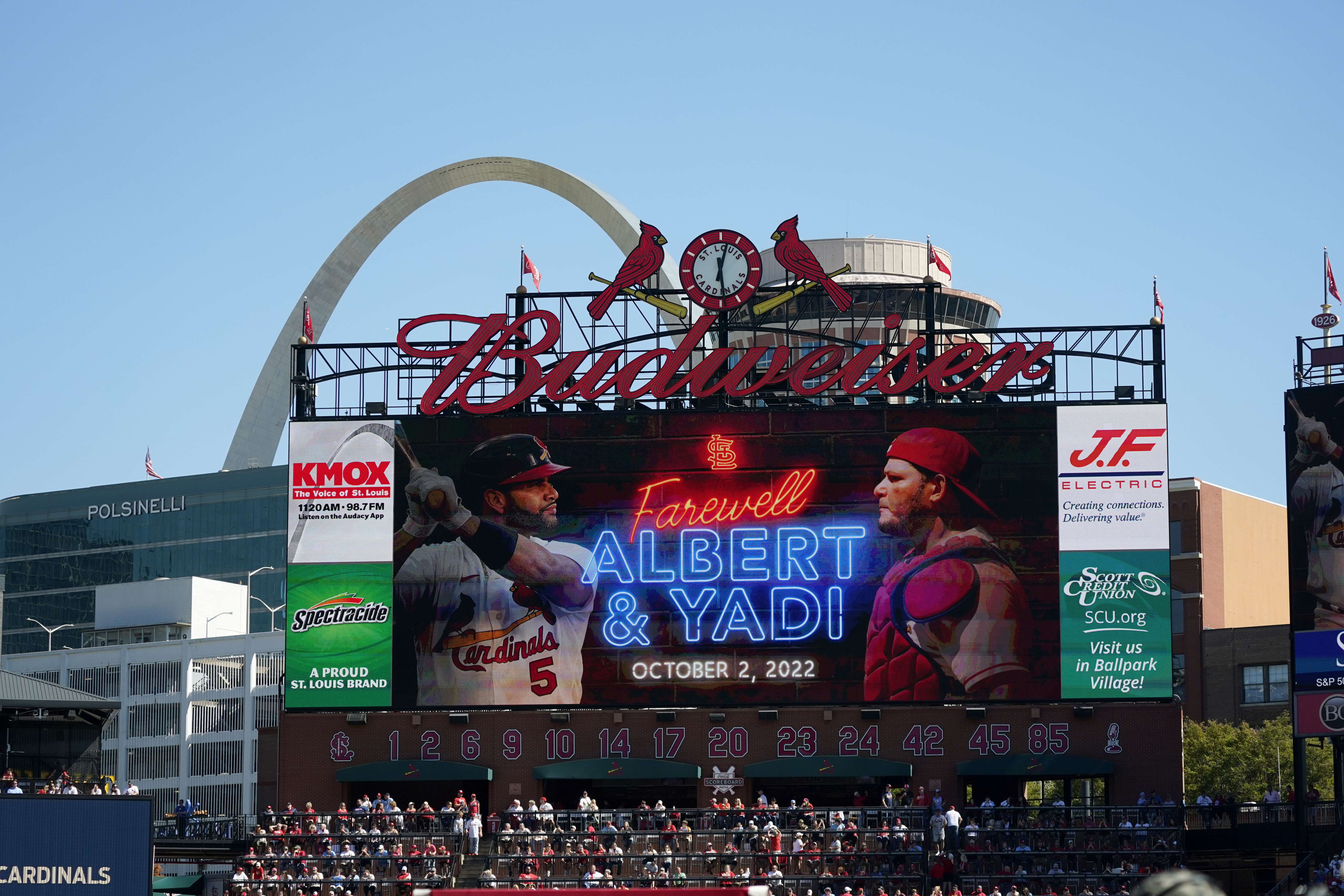 File - a video screen is seen in Busch Stadium as St. Louis Cardinals' Albert Pujols (5) and Yadier Molina (4) are honored during a ceremony before the start of the Cardinals' final regular season baseball game Sunday, Oct. 2, 2022, against the Pittsburgh Pirates in St. Louis. The Cardinals and the world’s leading brewer, Anheuser-Busch, announced, Wednesday, Dec. 13, 2023 that the two historic St. Louis institutions have agreed to a five-year extension of their long-term marketing agreement through 2030.