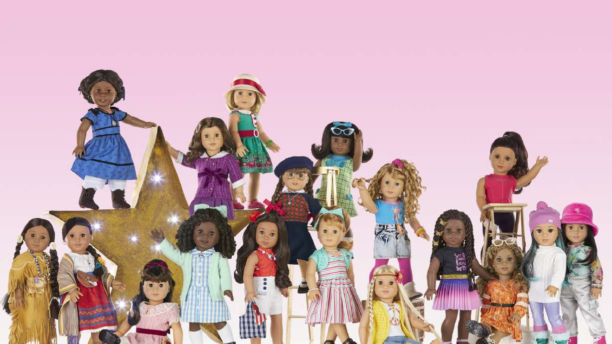 This image shows a variety of American Girl dolls. The toy company Mattel is developing a live-action film based on its American Girl doll line.