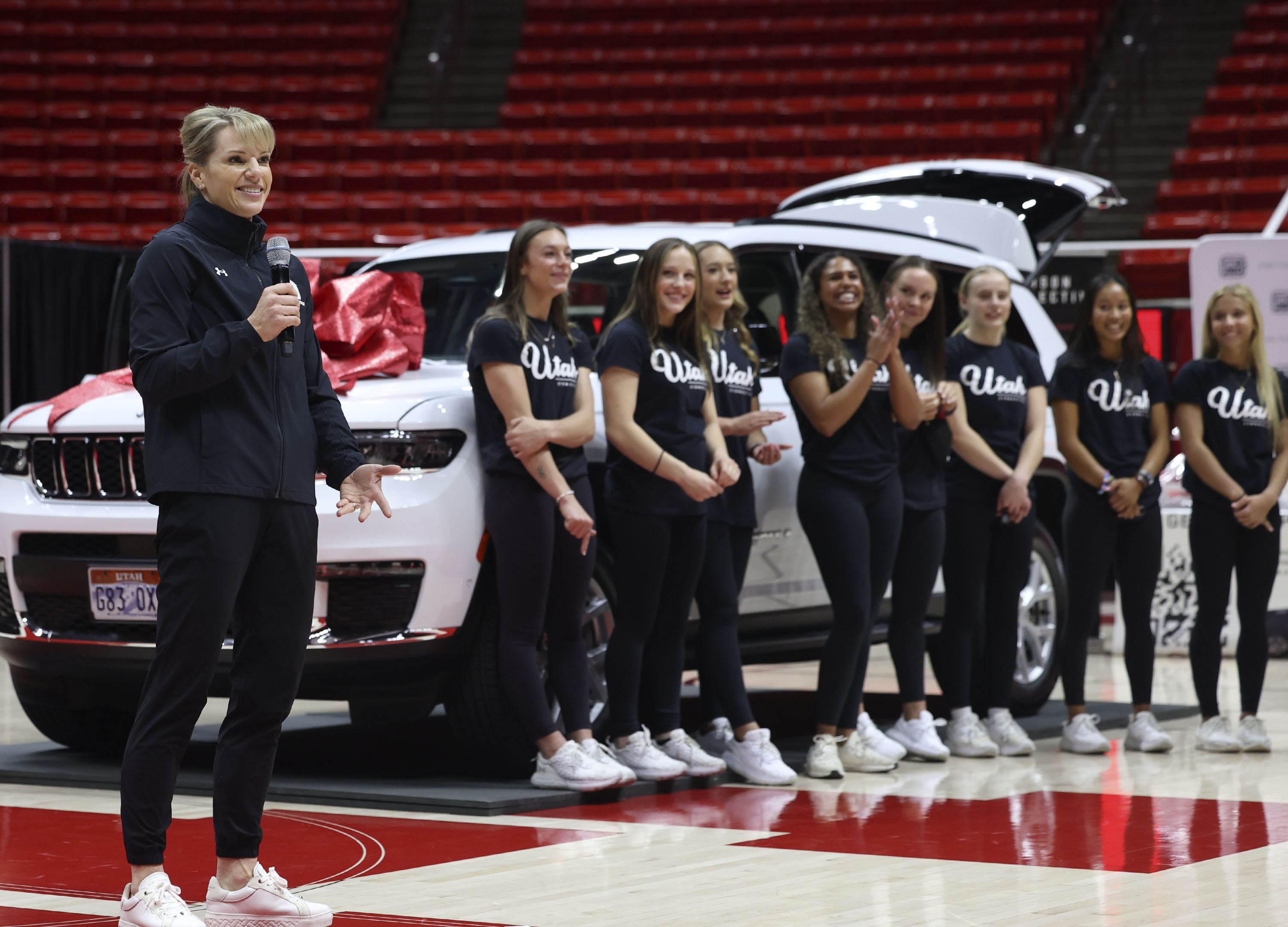 Utah gymnastics coach Carly Dockendorf speaks at the Huntsman Center in Salt Lake City on Wednesday, Dec. 13, 2023. A vehicle lease deal was made available to members of the women’s gymnastics and men’s and women’s basketball programs as part of a name, image and likeness package.