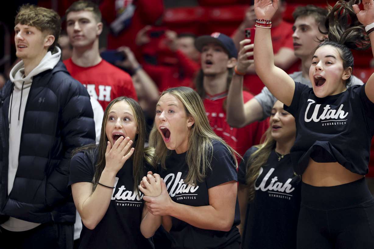 Utah men’s basketball player Cole Bajema, and gymnasts Ella Zirbes, Jaylene Gilstrap and Sarah Krump react to the announcement of a vehicle lease deal for members of the women’s gymnastics and men’s and women’s basketball programs as part of a name, image and likeness package at the Huntsman Center in Salt Lake City on Wednesday, Dec. 13, 2023.