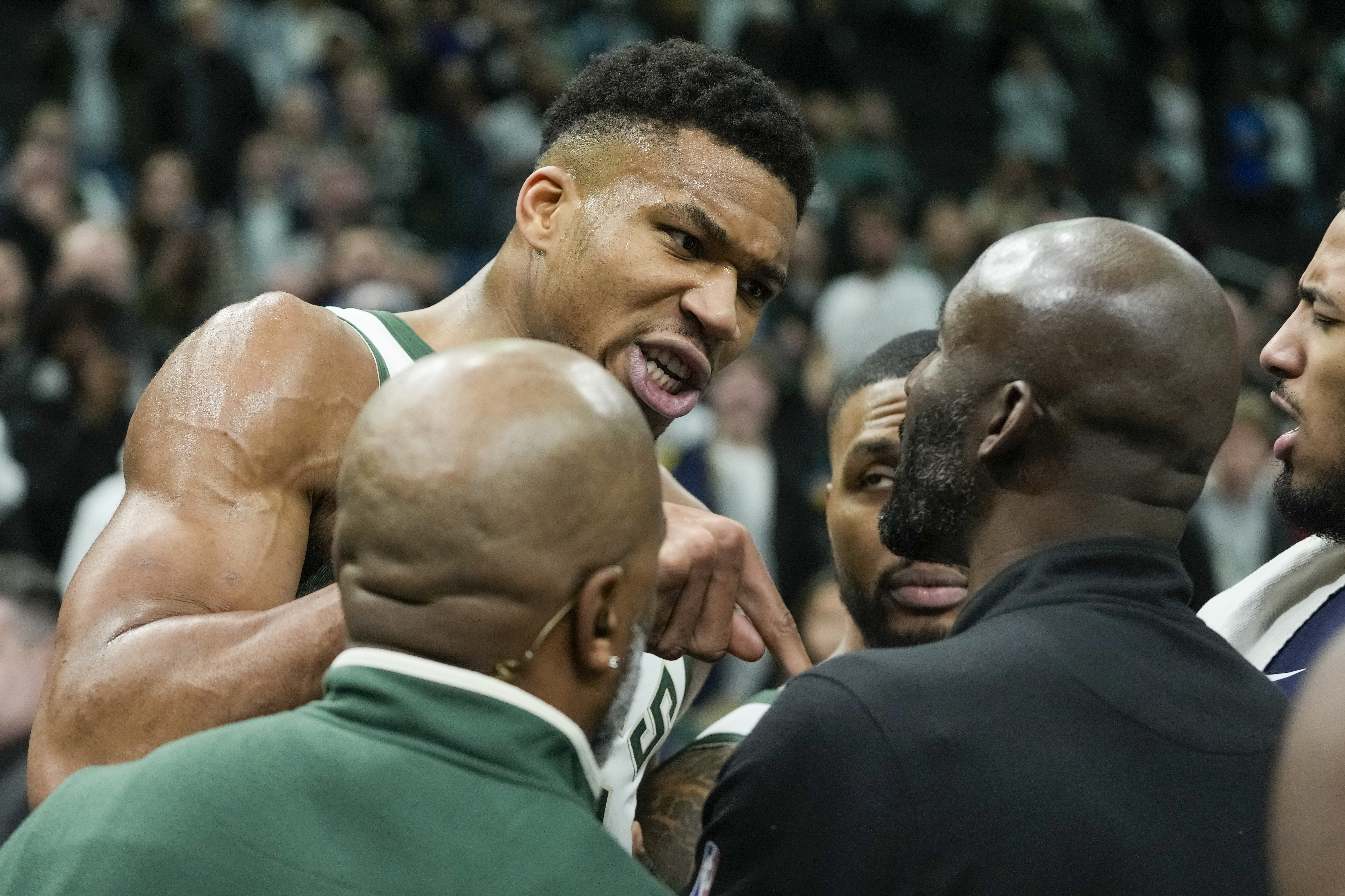 Milwaukee Bucks' Giannis Antetokounmpo argues with a Indiana Pacers coach after an NBA basketball game Wednesday, Dec. 13, 2023, in Milwaukee. 