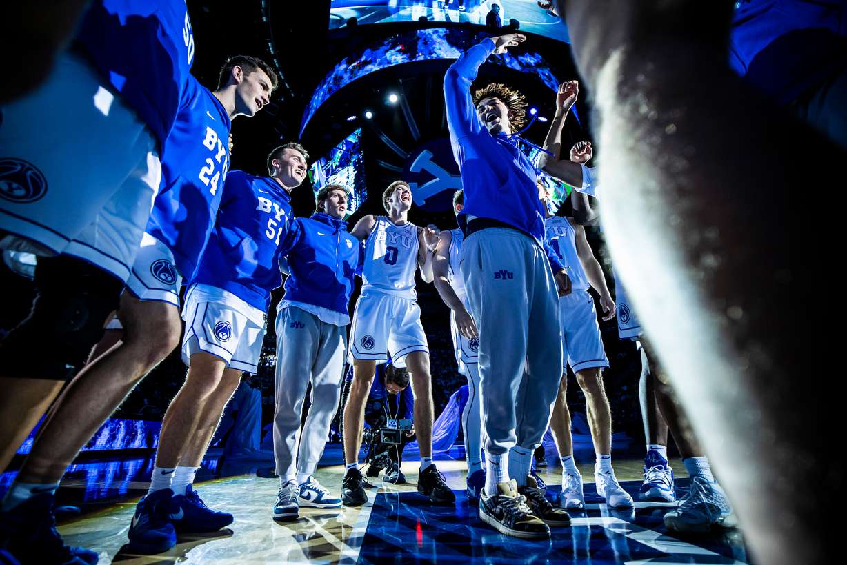 BYU freshman Marcus Adams Jr. (center) dances in the team huddle before the Cougars' 74-65 win over San Diego State, Nov. 10, 2023 at the Marriott Center in Provo.