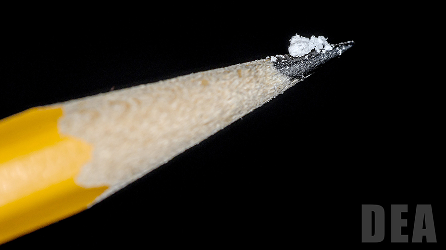 A lethal dose of fentanyl is displayed on the point of a pencil for size reference, according to the Drug Enforcement Association.