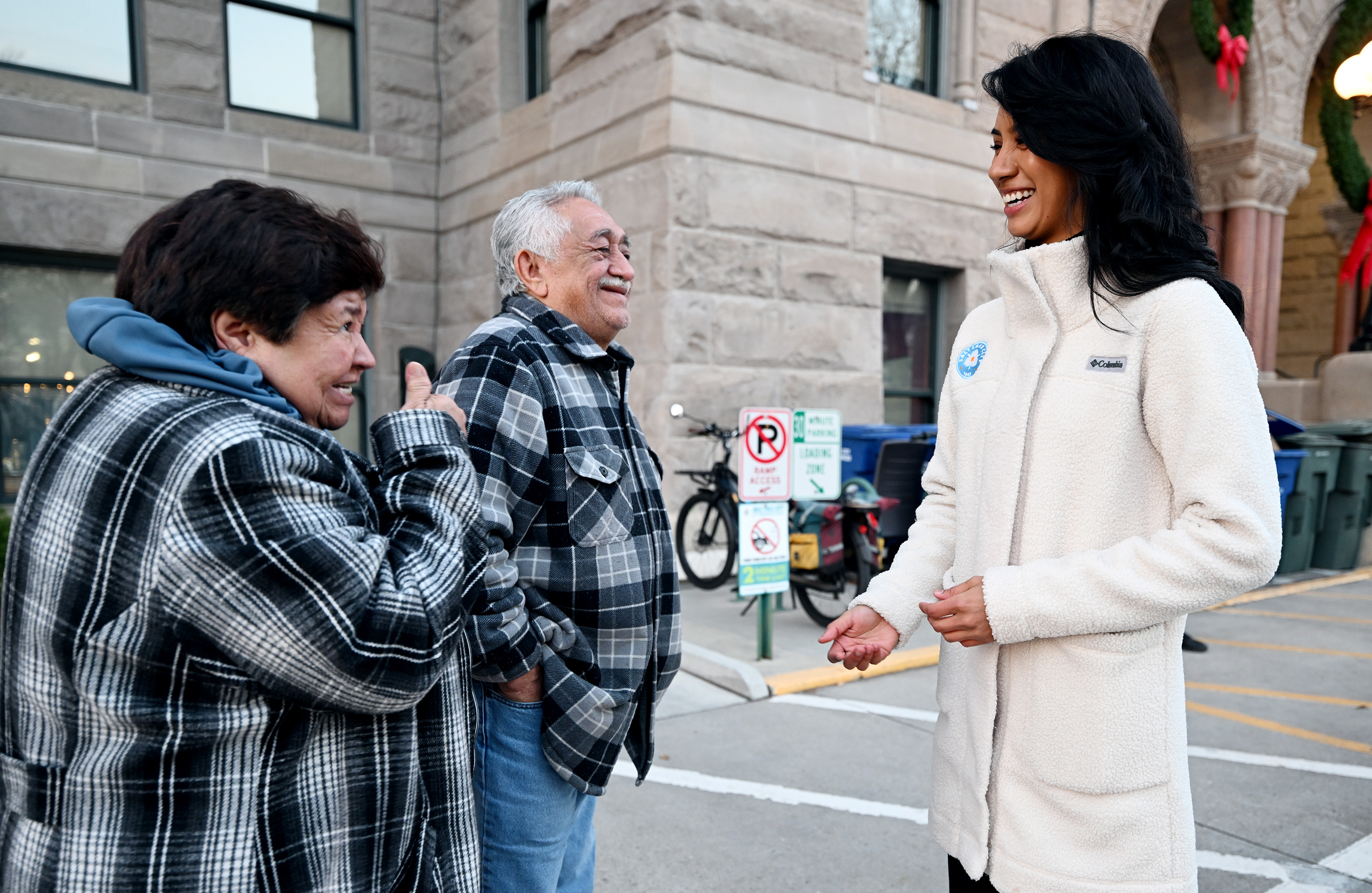 City employees Rafael and Olga Mejicanos talk with Salt Lake Councilwoman-elect Eva López Chávez outside the Salt Lake City-County Building in Salt Lake City on Wednesday.