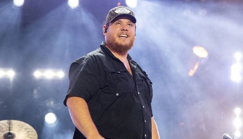 Luke Combs performs June 11, 2022 at CMA Fest, in Nashville, Tenn. Combs is making amends to a disabled Florida woman who sells tumblers online after she was ordered to pay him $250,000.