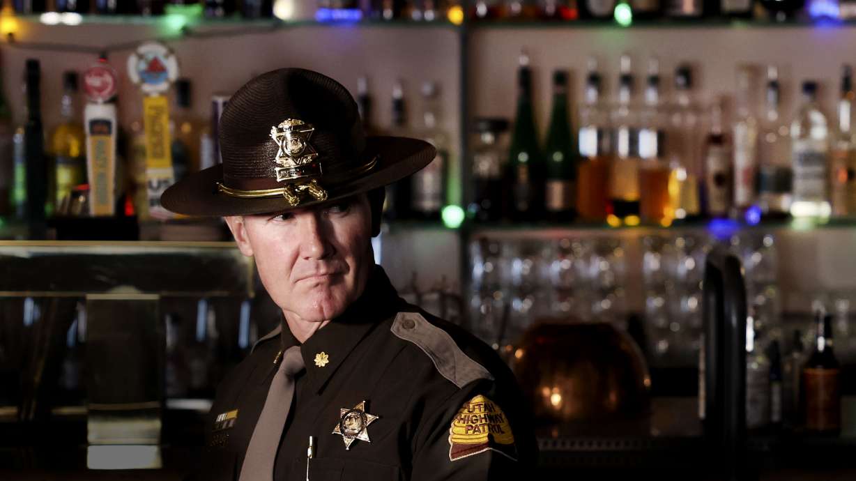 Utah Highway Patrol Maj. Steve Salas stands inside Bar X during a press conference urging drivers to add a sober ride to their winter holiday plans in Salt Lake City on Thursday.