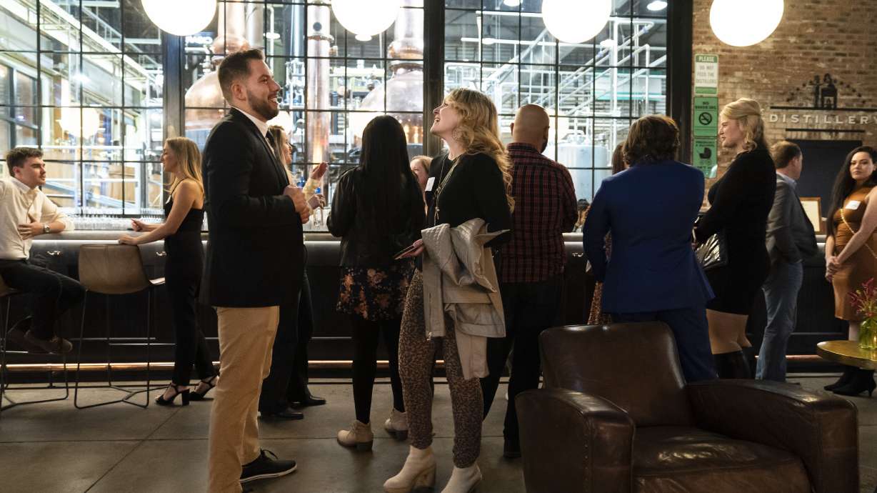 People mingle at a Philadelphia Distilling Daters Mixer in Philadelphia, Nov. 14. Some of the most populous urban areas in the U.S. have an imbalanced sex ratio.