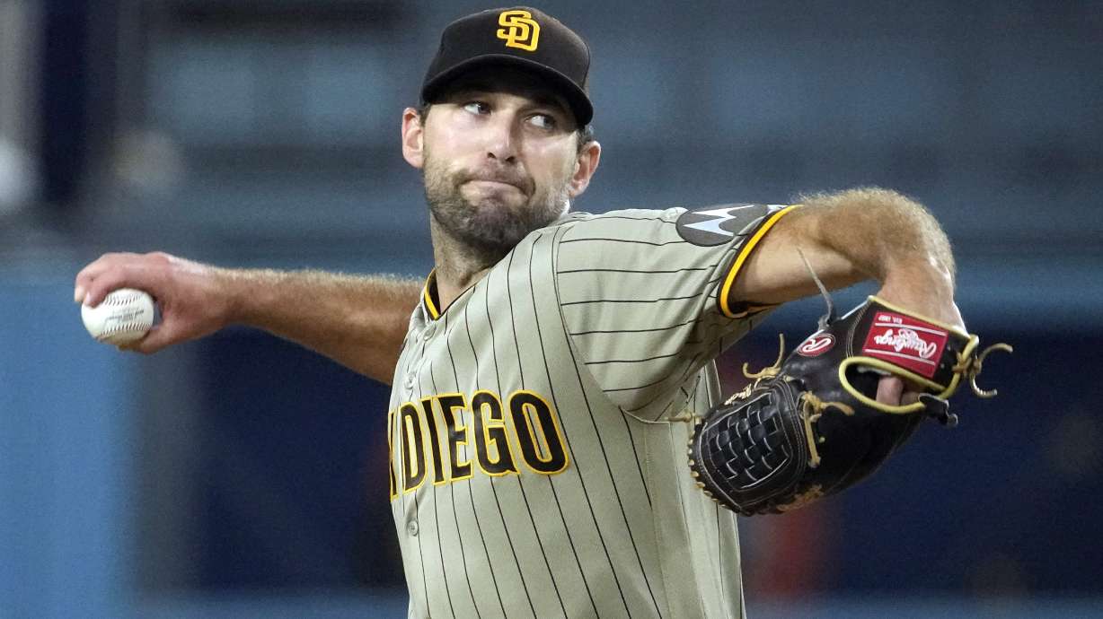 FILE - San Diego Padres starting pitcher Michael Wacha throws to the plate during the first inning of a baseball game against the Los Angeles Dodgers, Sept. 12, 2023, in Los Angeles. The Kansas City Royals made a pair of free-agent moves Friday, agreeing to a $32 million, two-year contract with pitcher Michael Wacha and a a $13 million, two-year deal with outfielder Hunter Renfroe. people familiar with the negotiations told The Associated Press. The people spoke on condition of anonymity Friday, Dec. 15, 2023, because the agreements had not been announced.