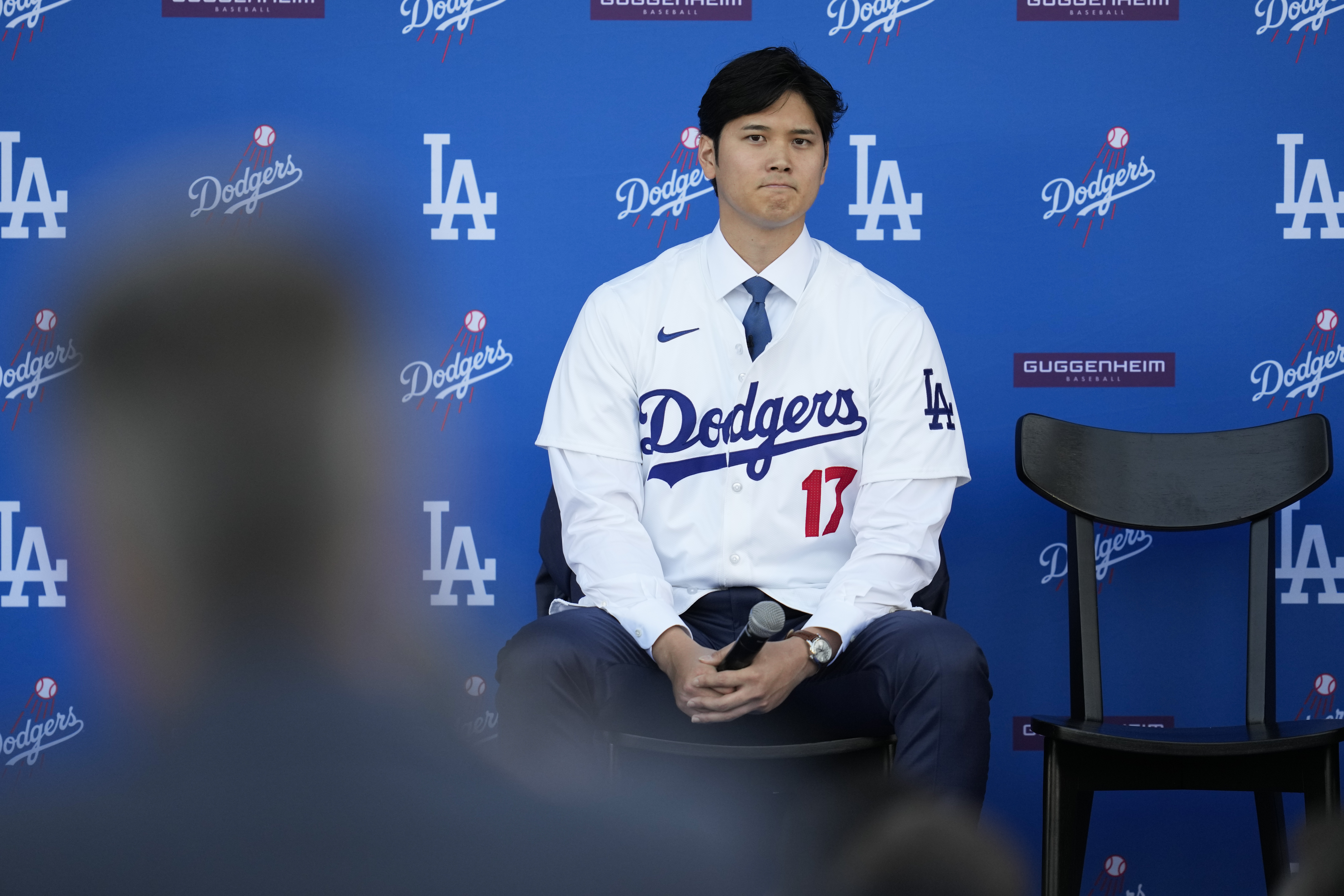 Los Angeles Dodgers' Shohei Ohtani listens to questions during a baseball news conference at Dodger Stadium Thursday, Dec. 14, 2023, in Los Angeles. 