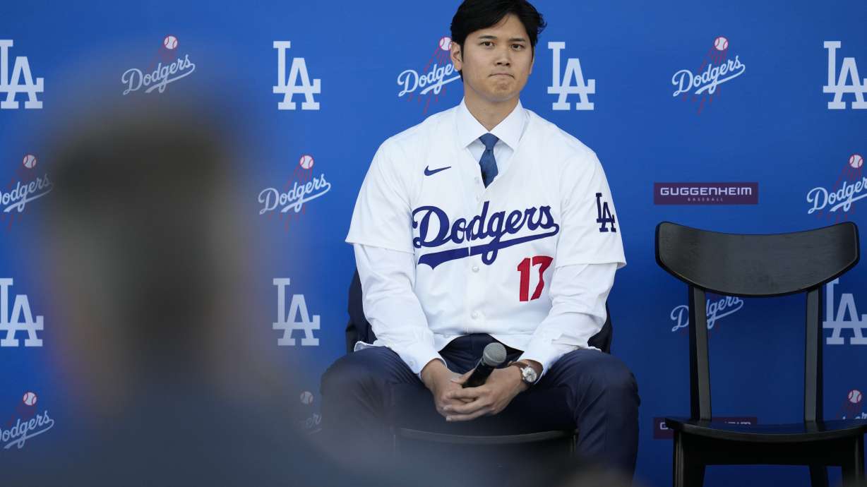 Los Angeles Dodgers' Shohei Ohtani listens to questions during a baseball news conference at Dodger Stadium Thursday, Dec. 14, 2023, in Los Angeles.