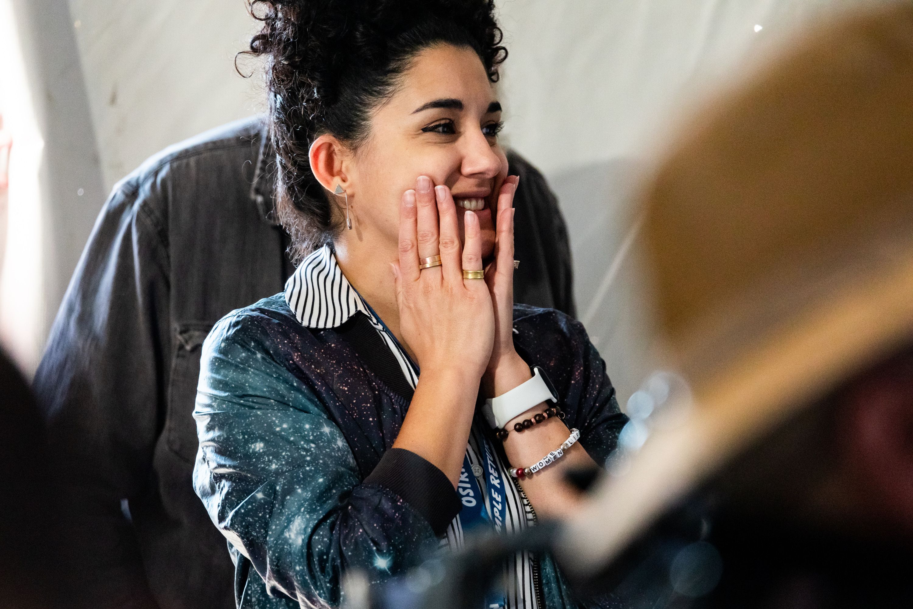 Arezu Sarvestani, from the Public Affairs Office at NASA’s Ames Research Center, watches the live broadcast as the capsule containing a sample collected from the Bennu asteroid as part of NASA’s Osiris-Rex mission enters the Earth’s atmosphere at the U.S. Army’s Dugway Proving Ground in Dugway on Sept. 24.