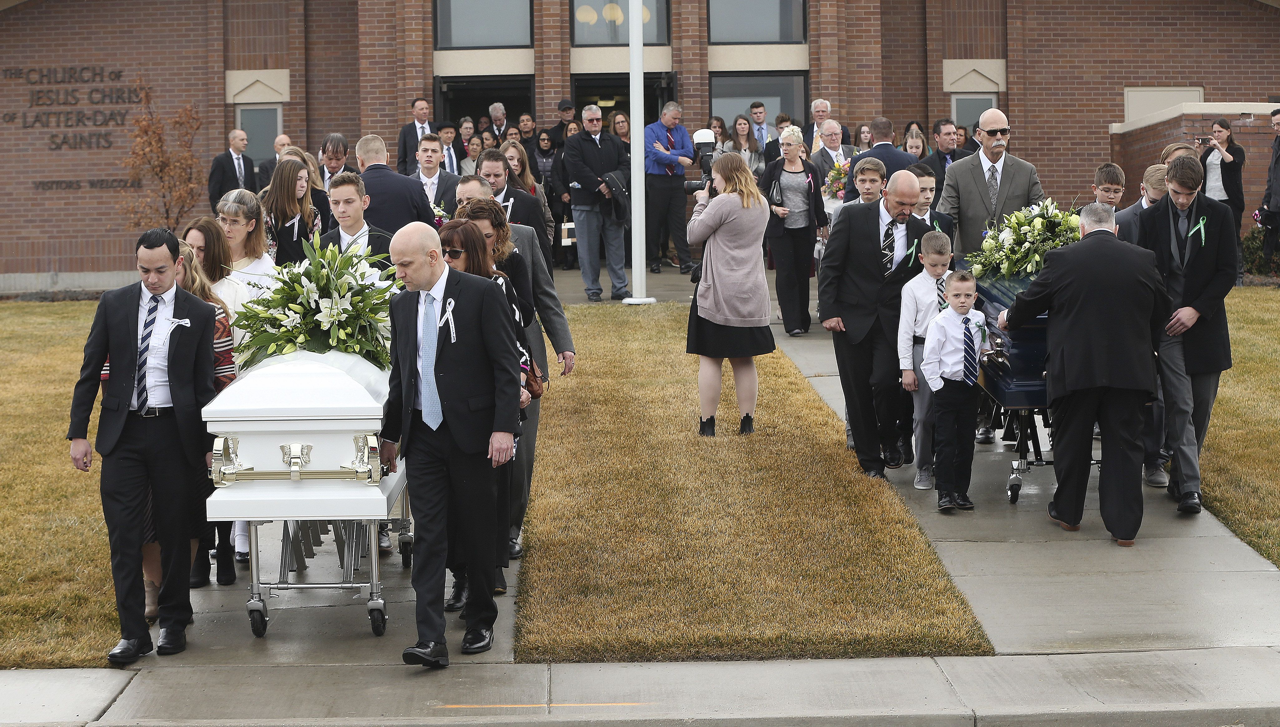 Pallbearers move the caskets of Consuelo Alejandra Haynie, and three of her children — Alexis, Matthew and Milan — following their funeral at the Grantsville Stake Center of The Church of Jesus Christ of Latter-day Saints in Grantsville on Jan. 24, 2020.