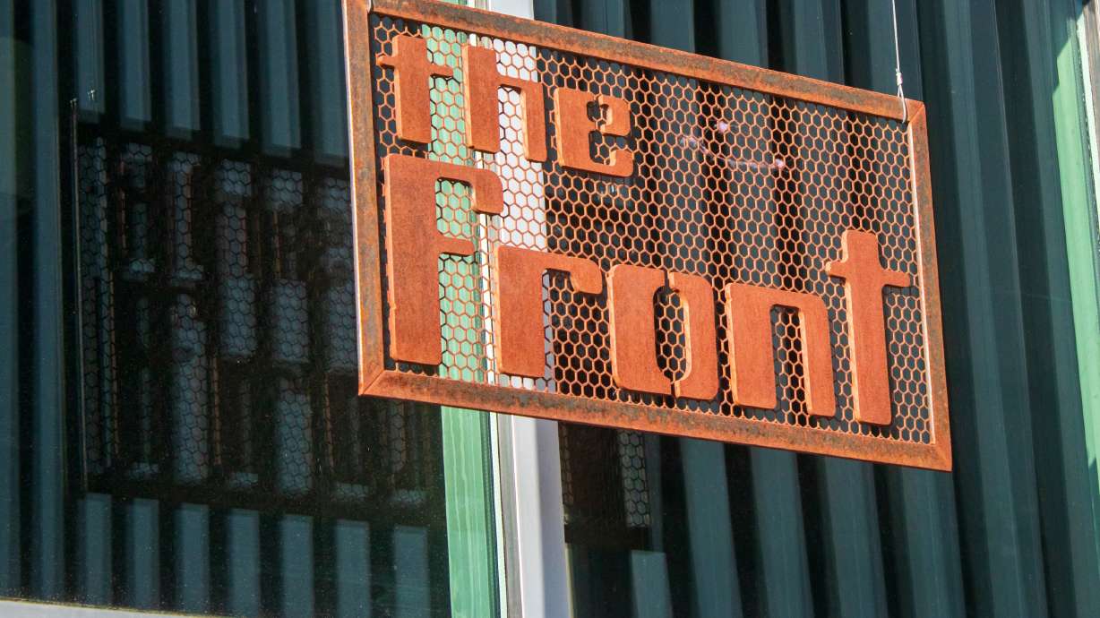 A sign on the exterior of the The Front Climbing Club Dec. 15, 2023. Salt Lake City's redevelopment agency paused a $2 million loan to the gym on Thursday, accusing its owner is trying to "quash" a major USA Climbing project.