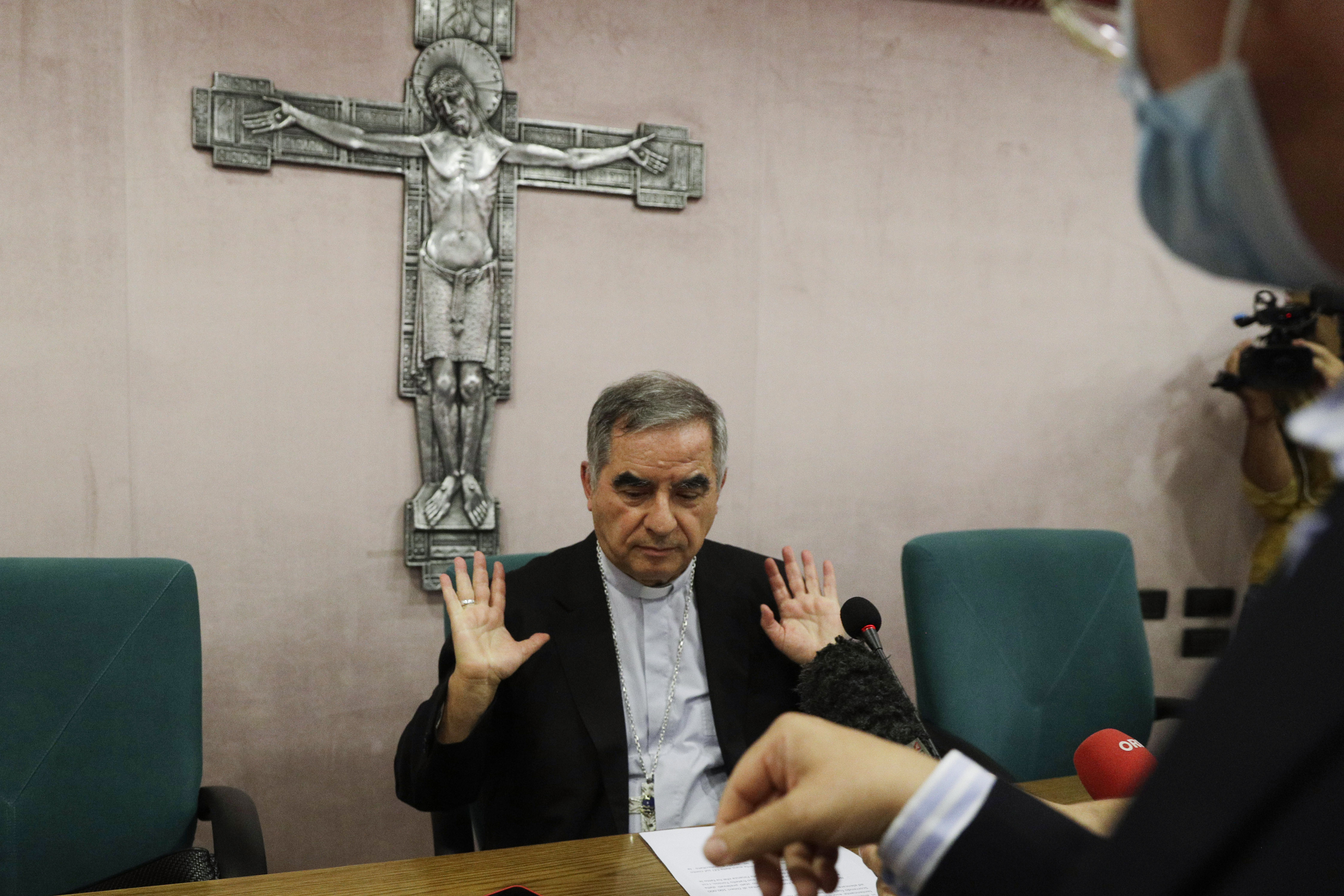 Cardinal Angelo Becciu talks to journalists during a press conference in Rome on Sept. 25, 2020. Lawyers for the once-powerful cardinal have accused Vatican prosecutors of being "prisoners to their completely shattered theory" in closing arguments of a two-year trial. Becciu is on trial along with nine other people in a case that is focused on the Vatican's 350 million euro investment in a London property.