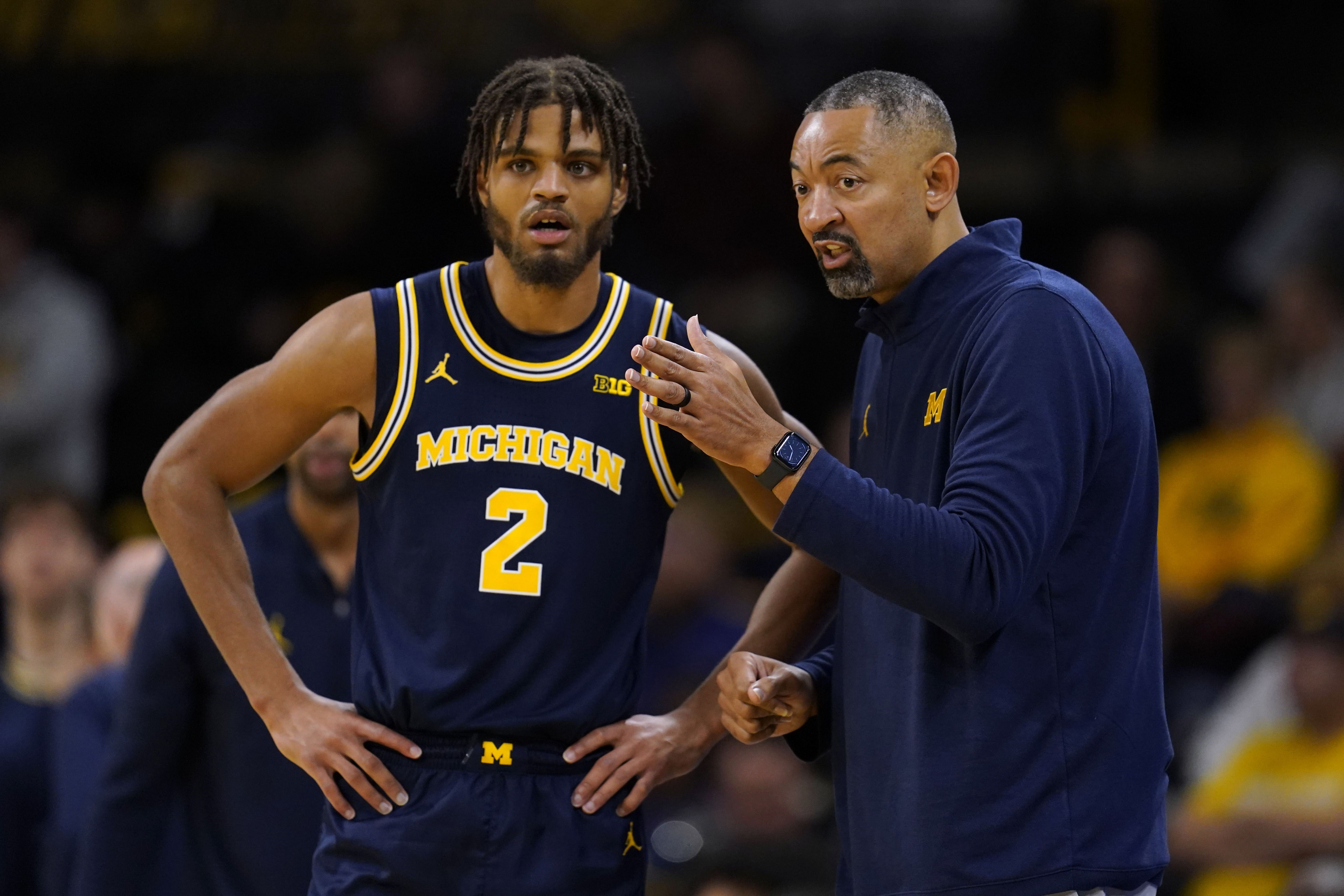 Michigan head coach Juwan Howard talks with forward Tray Jackson (2) during the first half of an NCAA college basketball game against Iowa, Sunday, Dec. 10, 2023, in Iowa City, Iowa. 