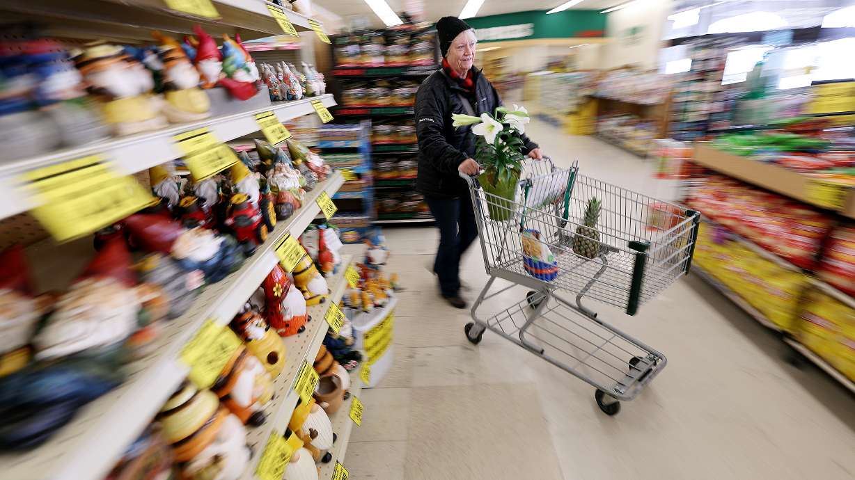 Sherrie Robertson shops at Reams in Sandy on April 4. The U.S. economy is improving by many measures. Yet, pessimism persists when it comes to how the public feels about the economy.