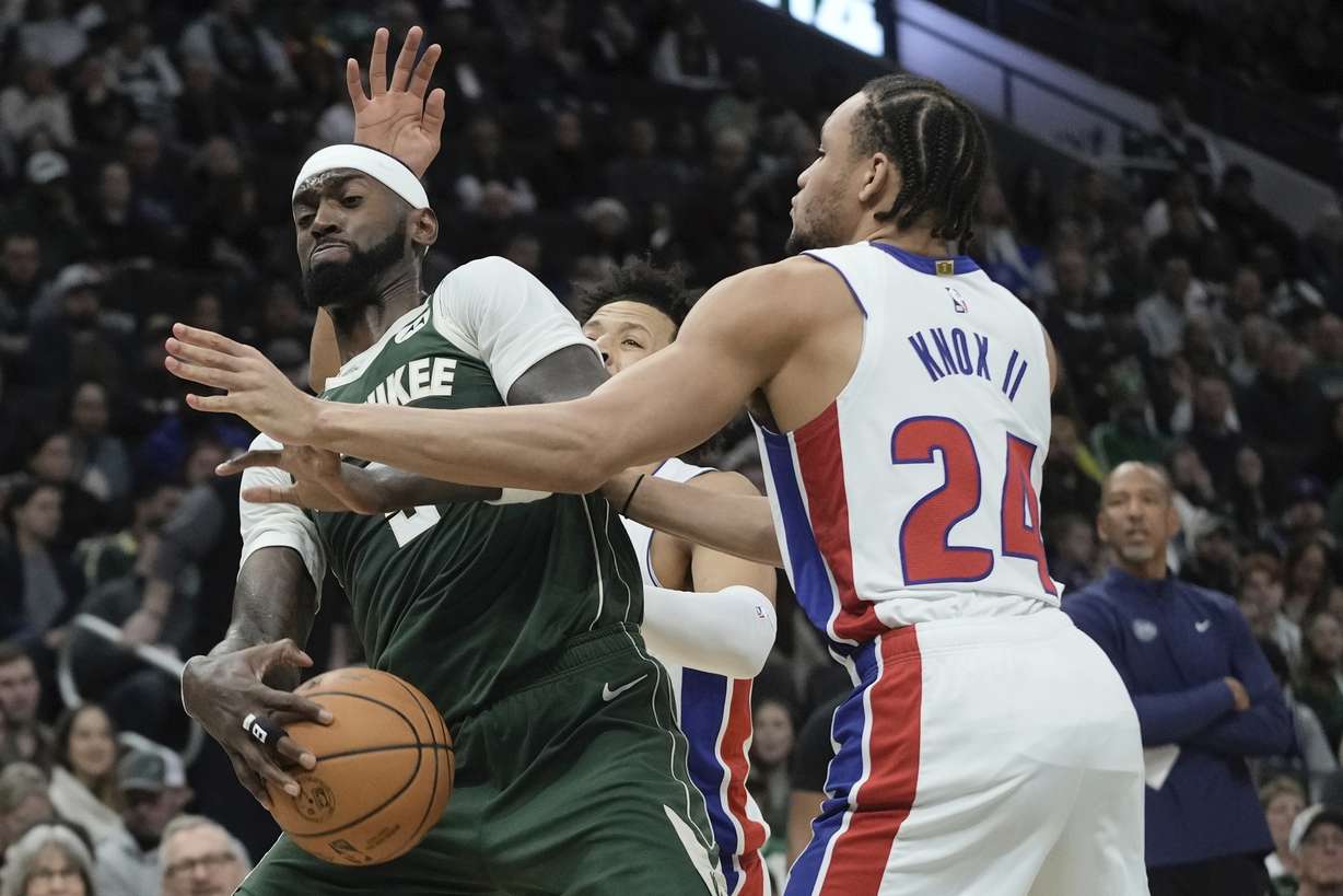 Detroit Pistons' Kevin Knox II fouls Milwaukee Bucks' Bobby Portis during the first half of an NBA basketball game Saturday, Dec. 16, 2023, in Milwaukee.