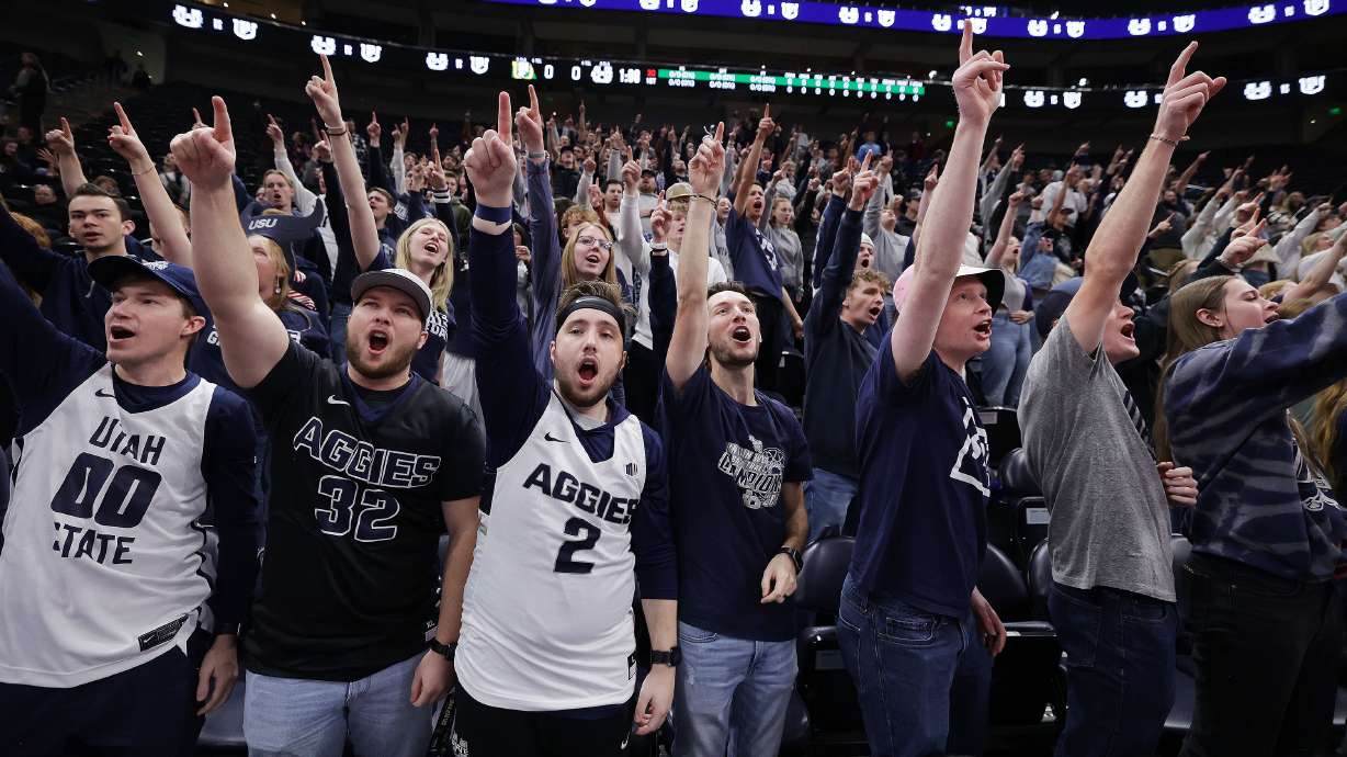 Utah State Aggies fans cheer is a game with the San Francisco Dons at the Delta Center in Salt Lake City on Saturday, Dec. 16, 2023.
