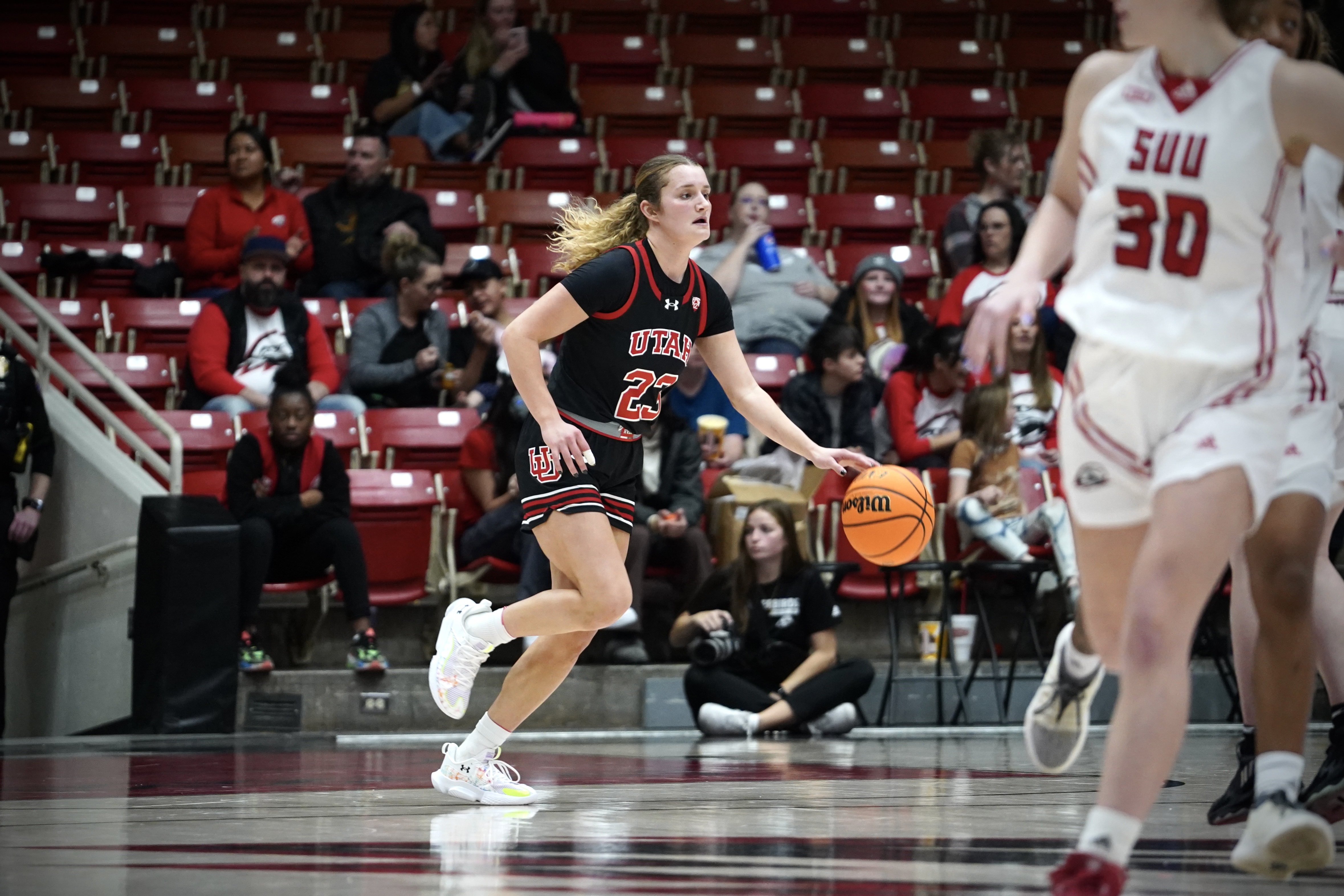 Maty Wilke dribbles the ball down the court in a road game against Southern Utah in Cedar City on Dec. 16, 2023.