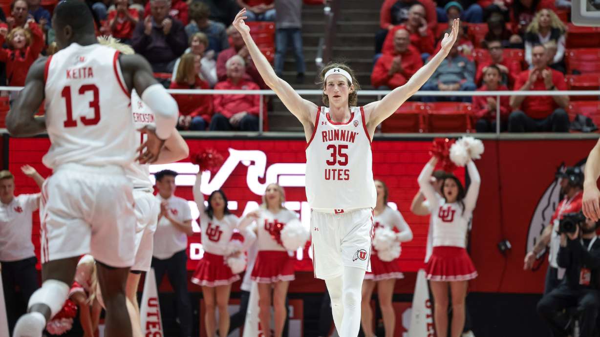 Utah Utes center Branden Carlson (35) hypes up the crowd after sinking a three during the game against the Utah Valley Wolverines at the Huntsman Center in Salt Lake City on Saturday, Dec. 16, 2023.